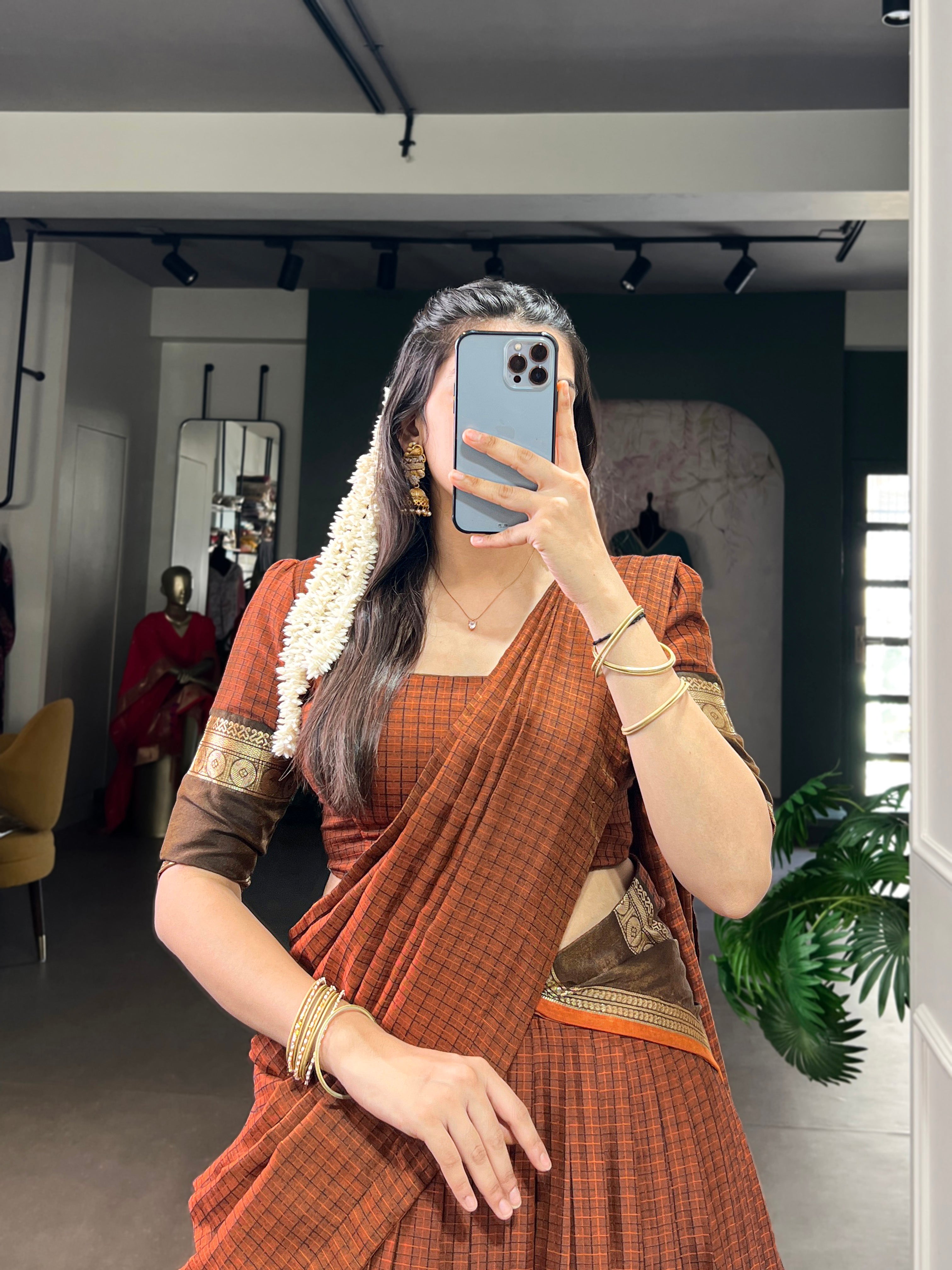 Rimi rust orange Chettinad cotton chex half-saree lehenga with rich zari weaving work