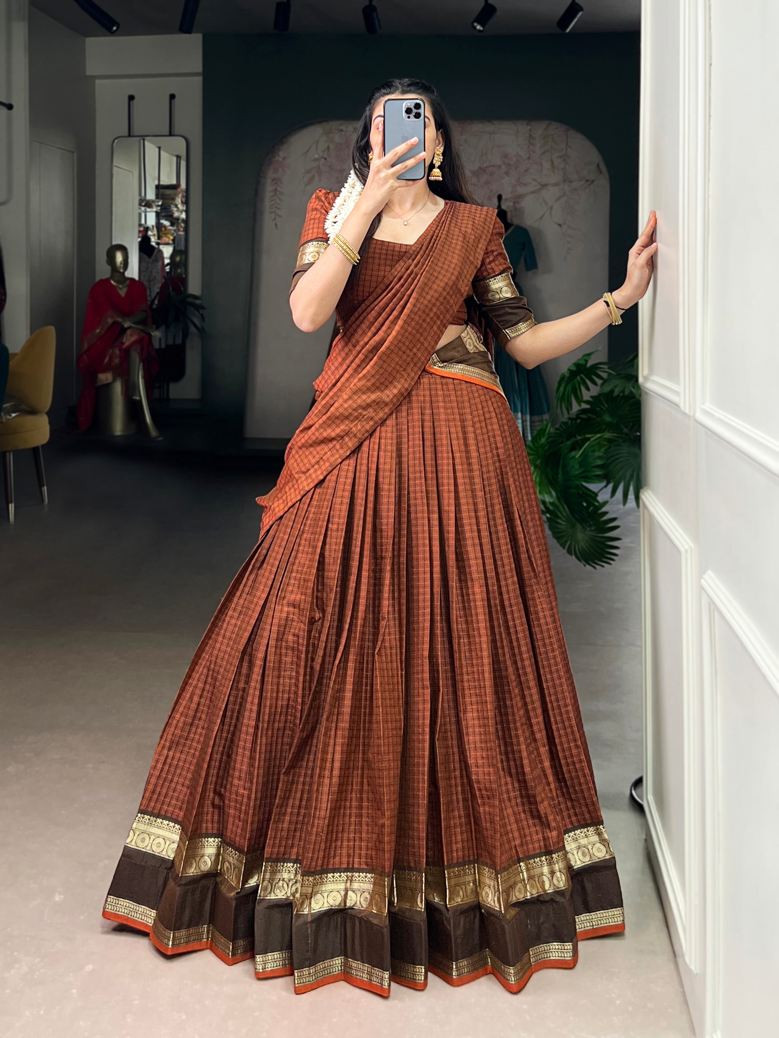 Rimi rust orange Chettinad cotton chex half-saree lehenga with rich zari weaving work