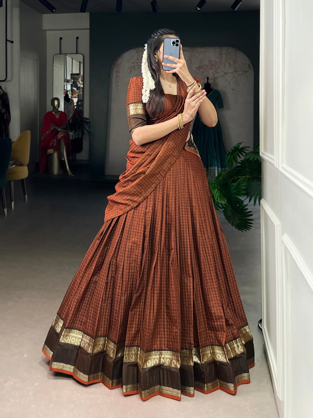Rimi rust orange Chettinad cotton chex half-saree lehenga with rich zari weaving work
