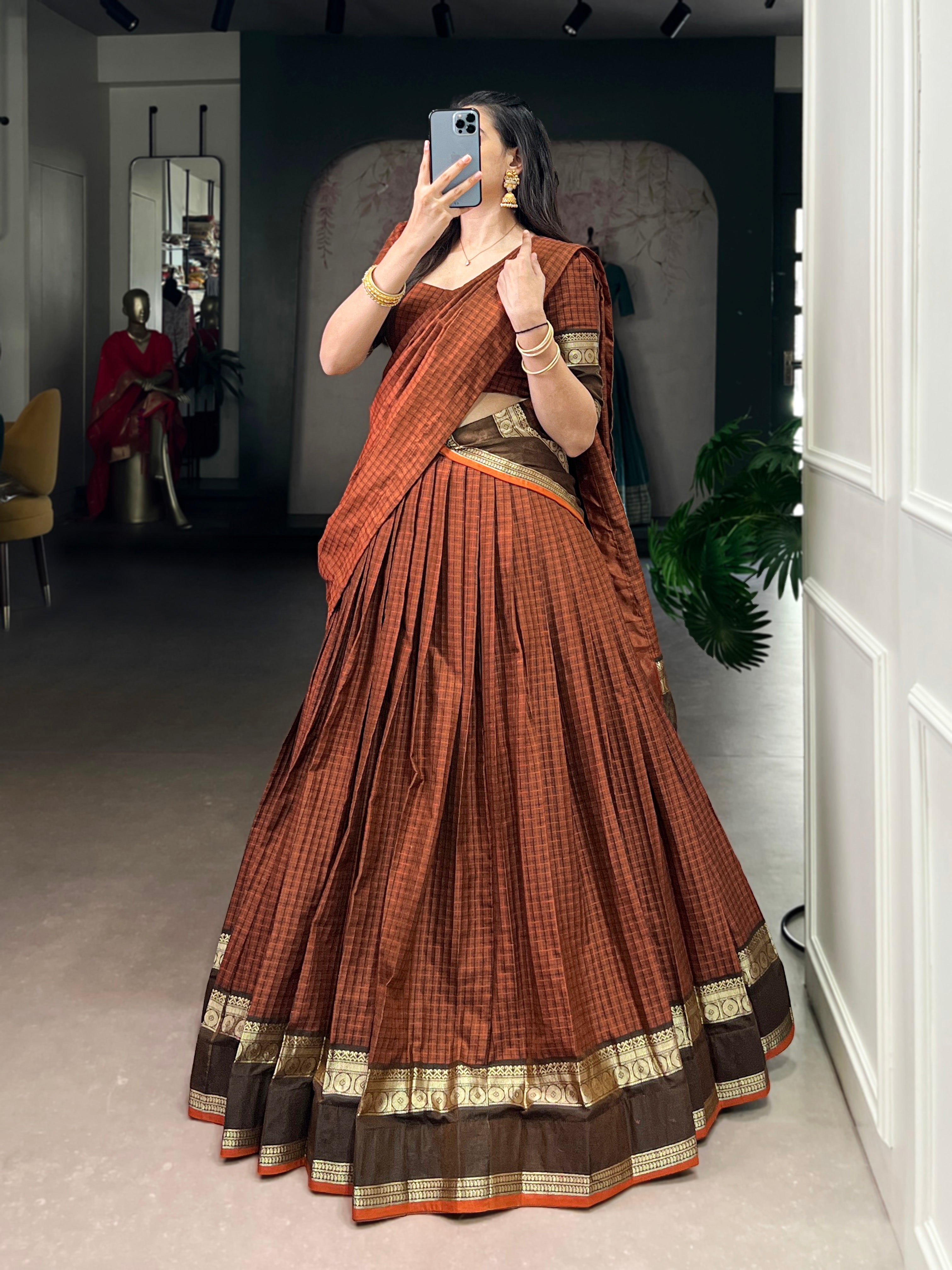 Rimi rust orange Chettinad cotton chex half-saree lehenga with rich zari weaving work