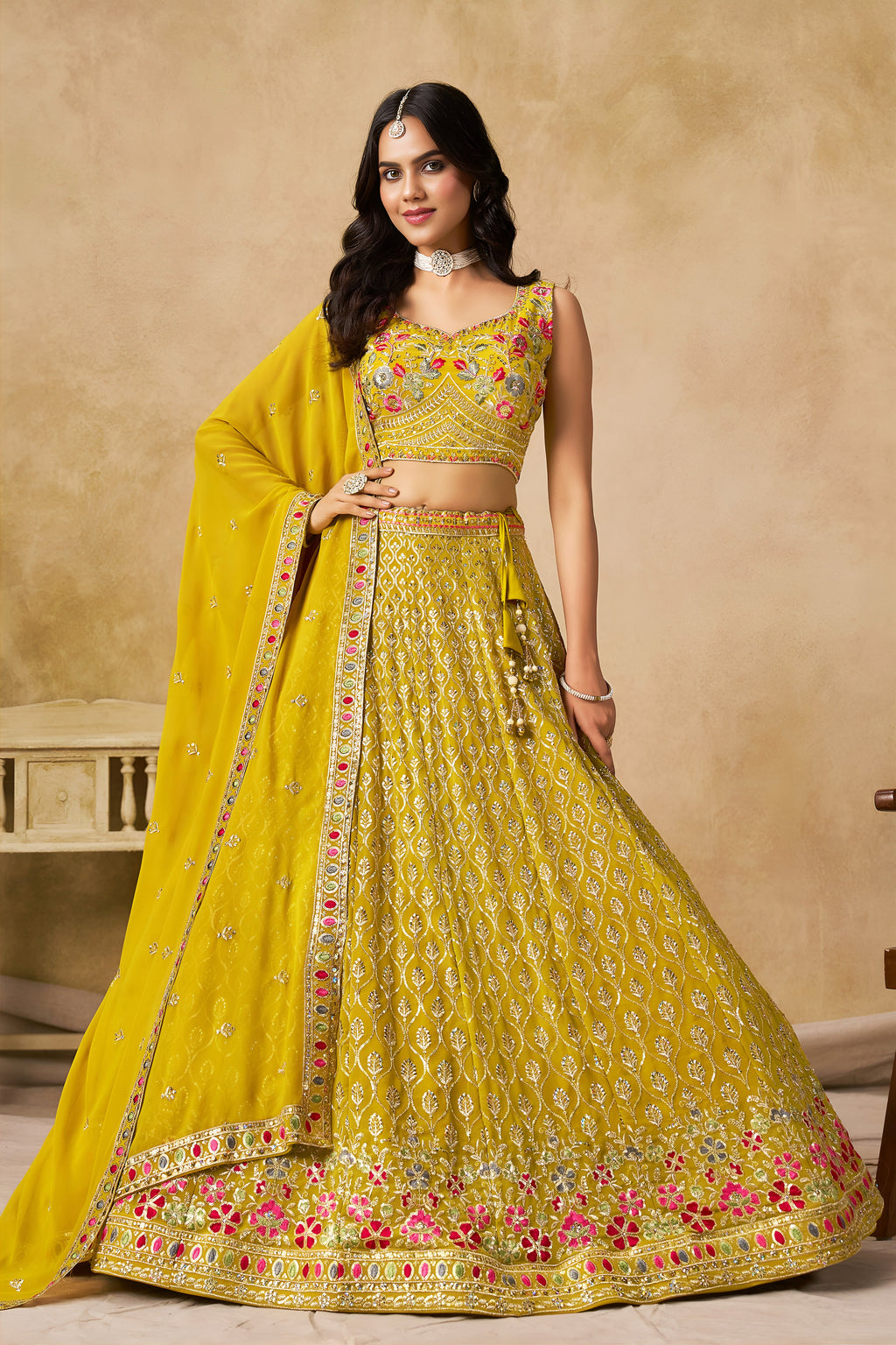 Sakhi yellow soft georgette lehenga choli with sequins zari resham and badla embroidery work