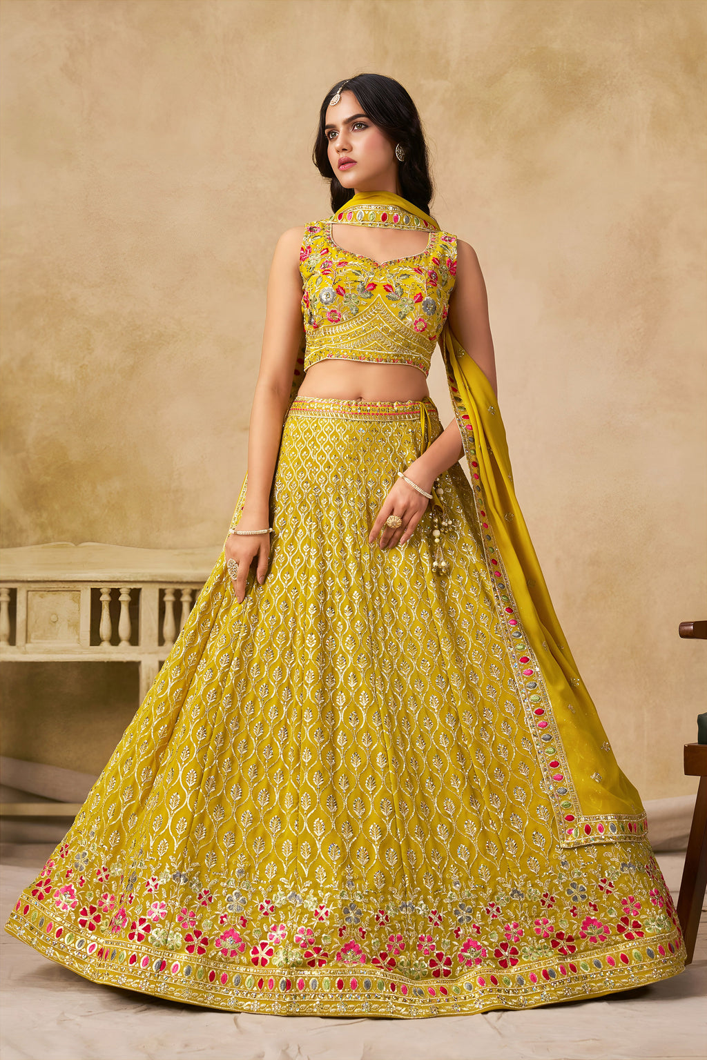 Sakhi yellow soft georgette lehenga choli with sequins zari resham and badla embroidery work