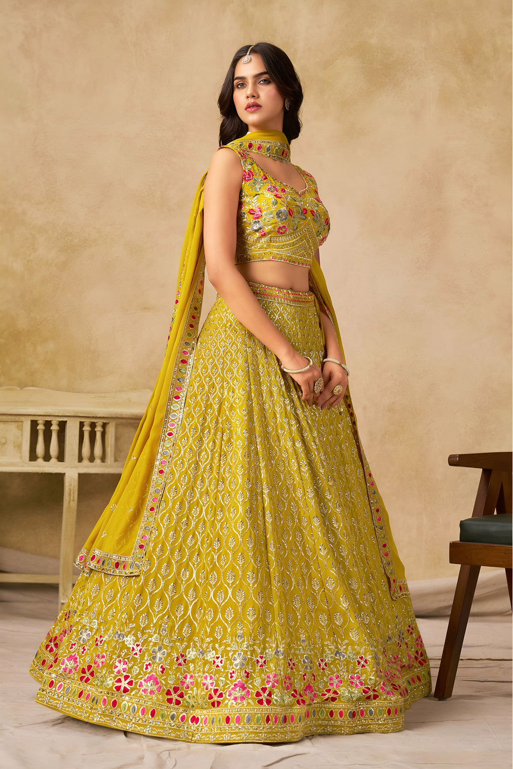 Sakhi yellow soft georgette lehenga choli with sequins zari resham and badla embroidery work