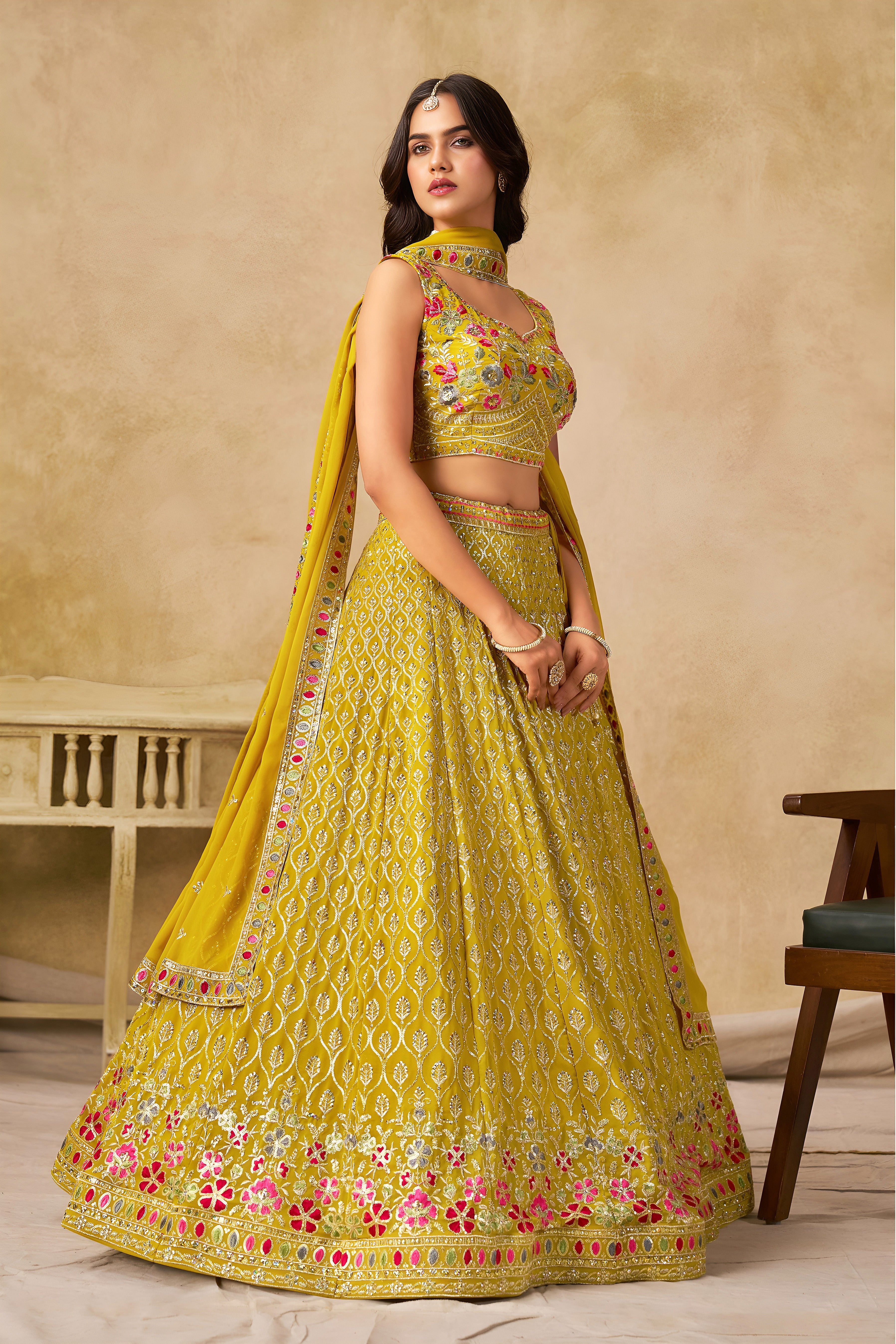 Sakhi yellow soft georgette lehenga choli with sequins zari resham and badla embroidery work