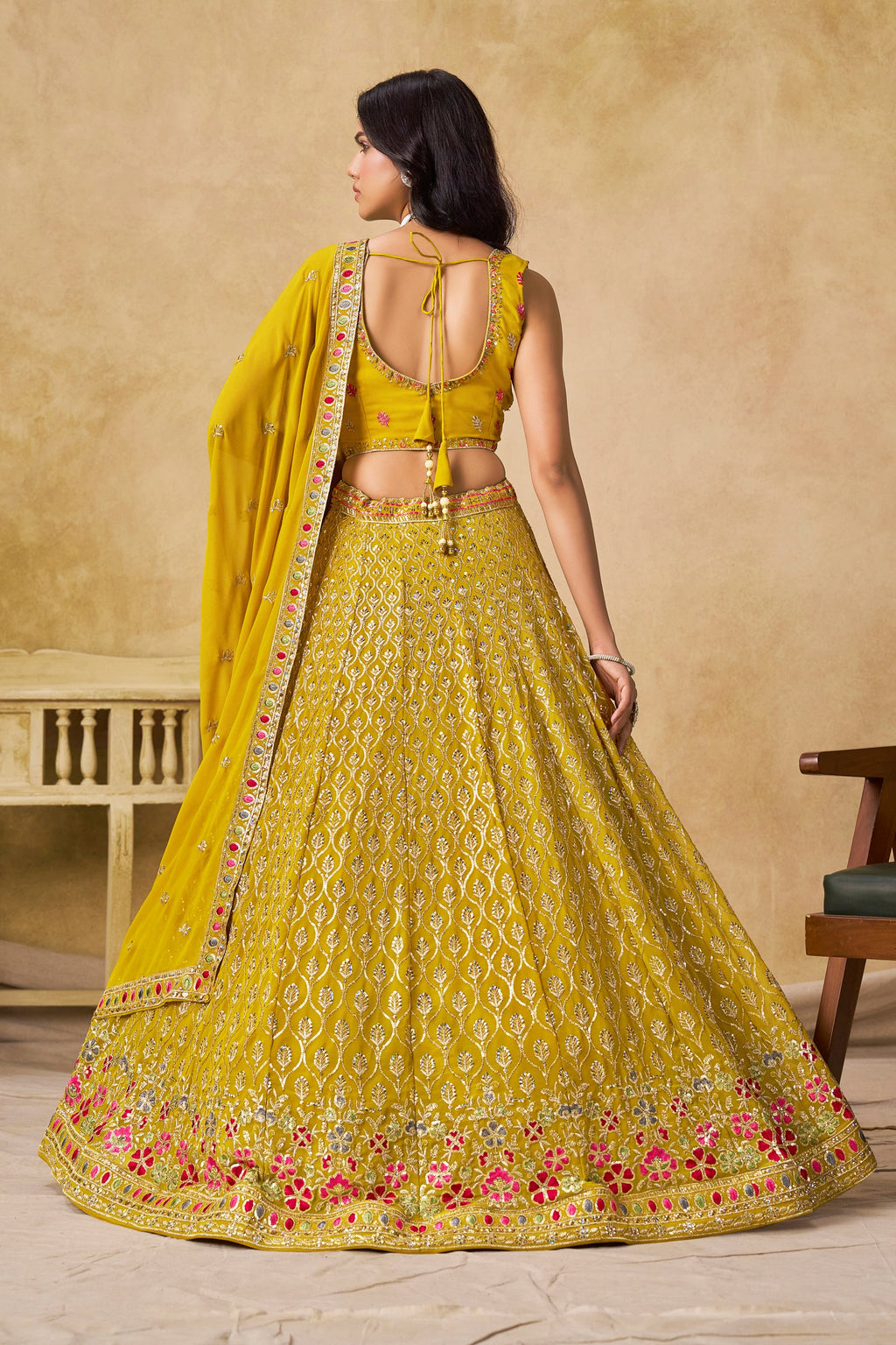 Sakhi yellow soft georgette lehenga choli with sequins zari resham and badla embroidery work