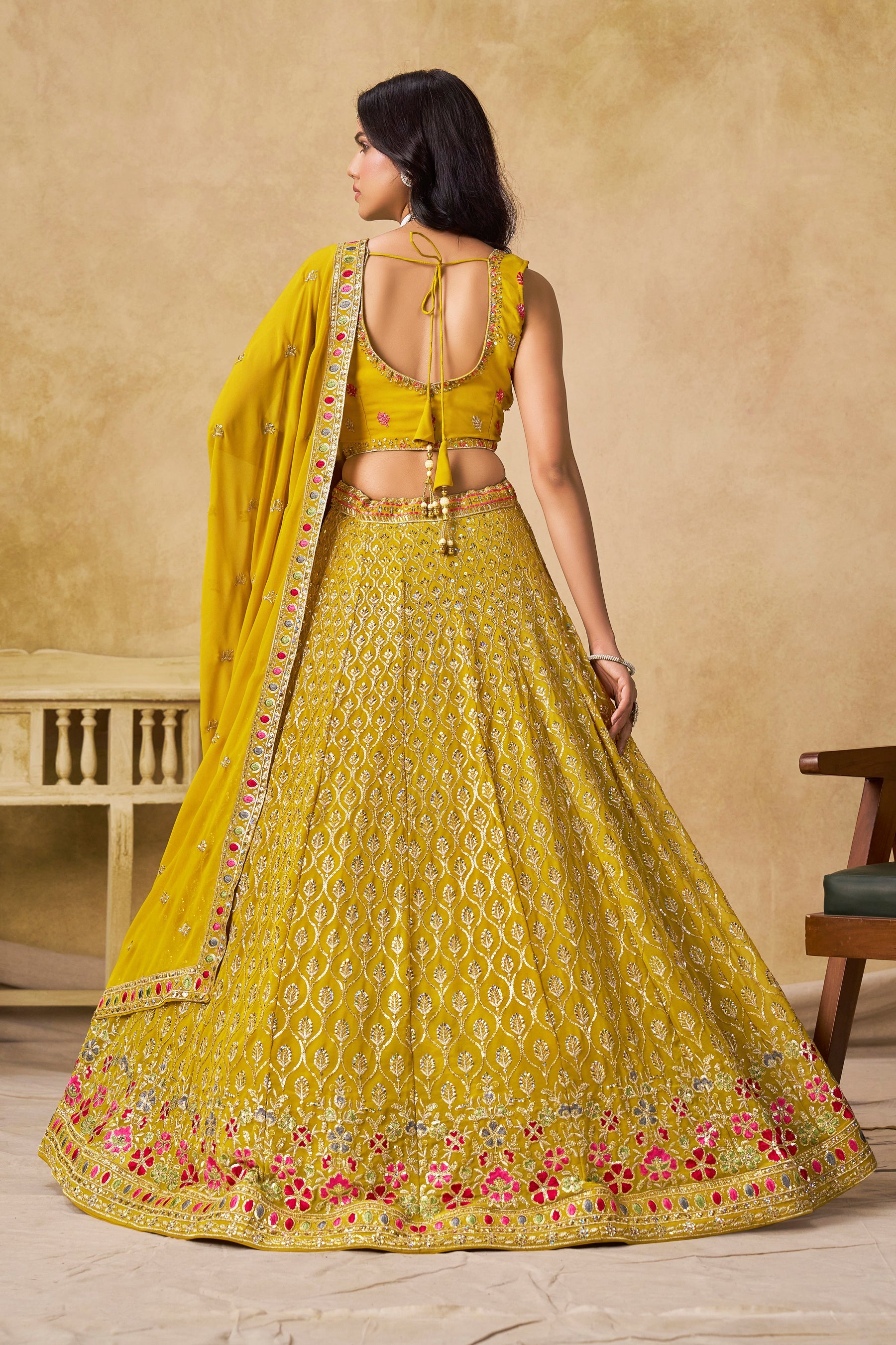 Sakhi yellow soft georgette lehenga choli with sequins zari resham and badla embroidery work