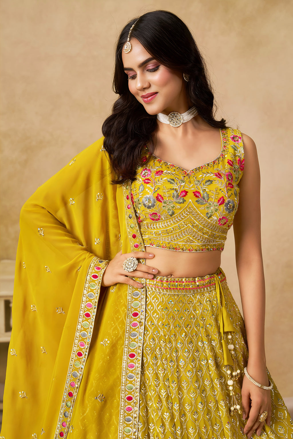 Sakhi yellow soft georgette lehenga choli with sequins zari resham and badla embroidery work