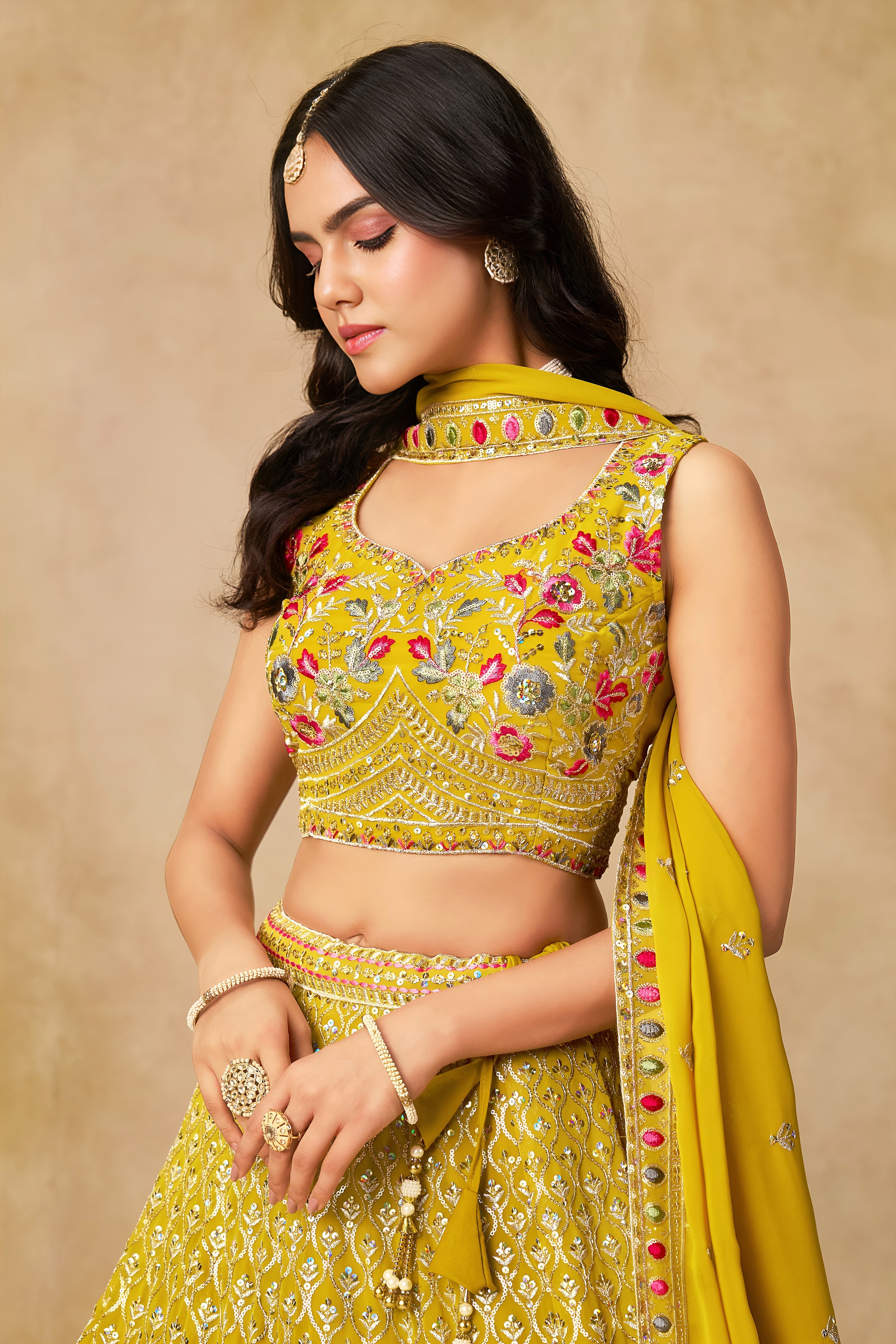 Sakhi yellow soft georgette lehenga choli with sequins zari resham and badla embroidery work