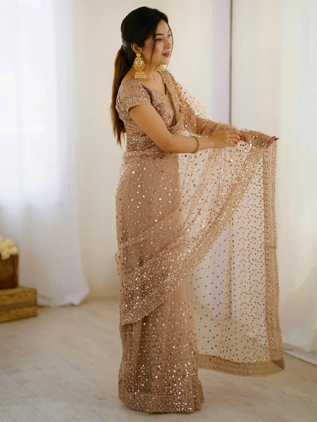 Golden net saree with sequins embroidery and blouse