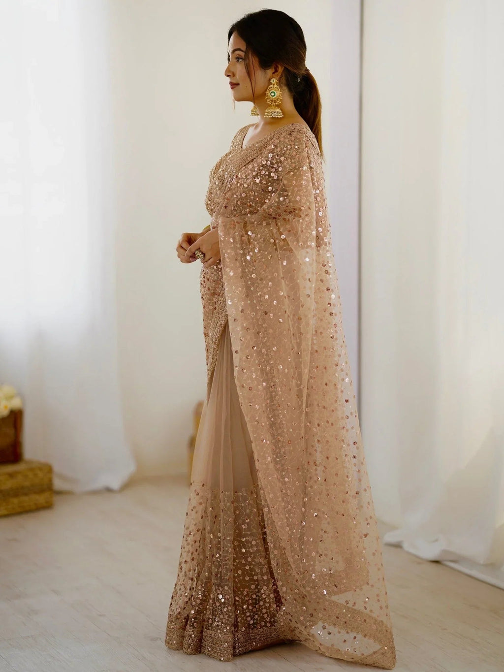 Golden net saree with sequins embroidery and blouse