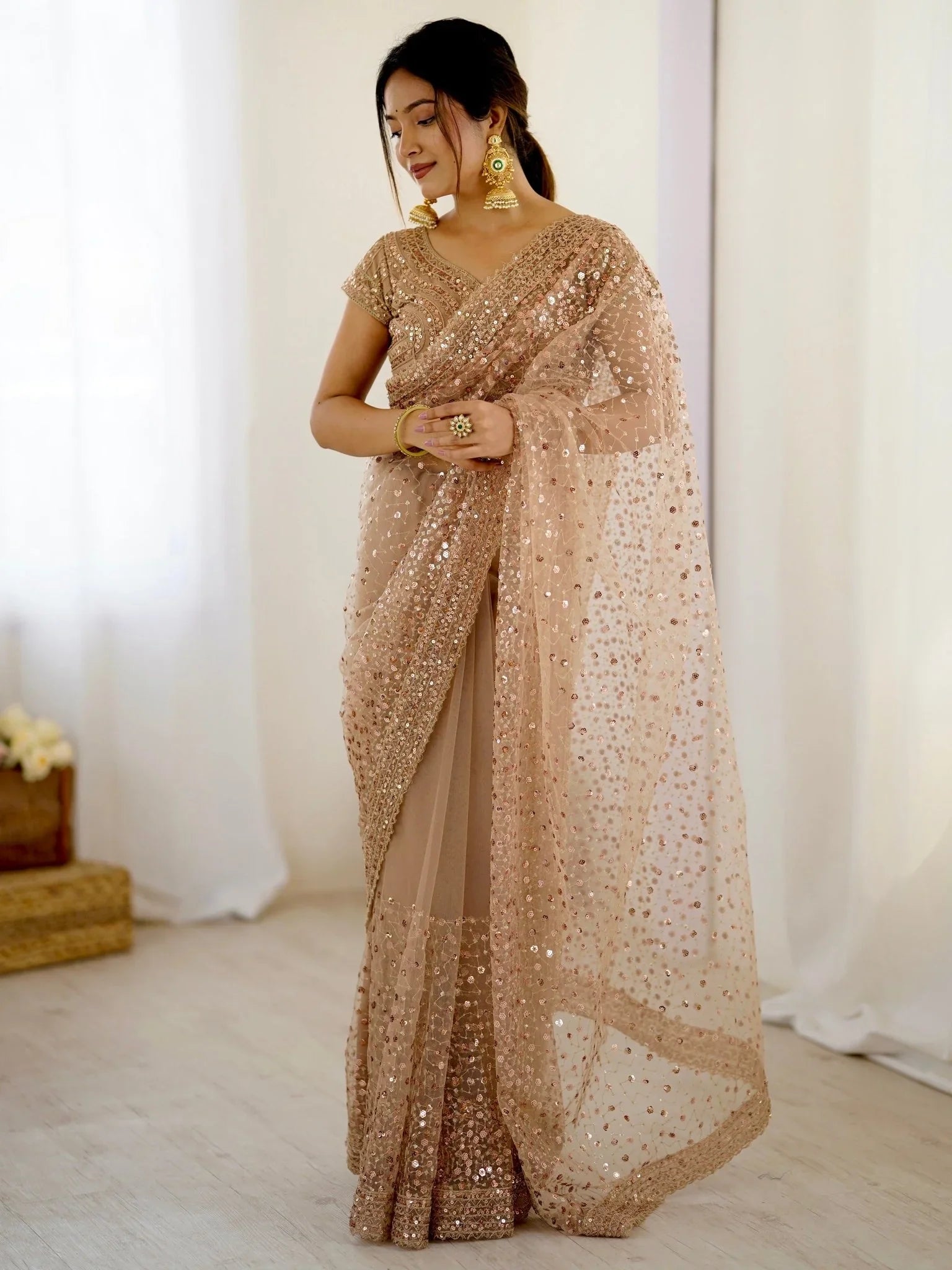 Golden net saree with sequins embroidery and blouse