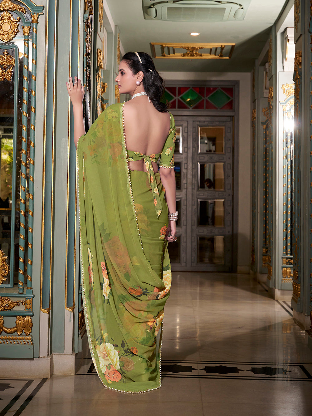 Green georgette printed saree with pearl lace border