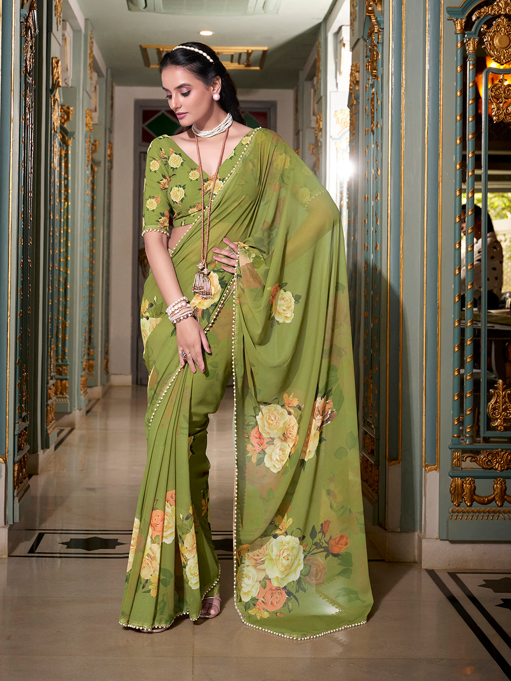 Green georgette printed saree with pearl lace border