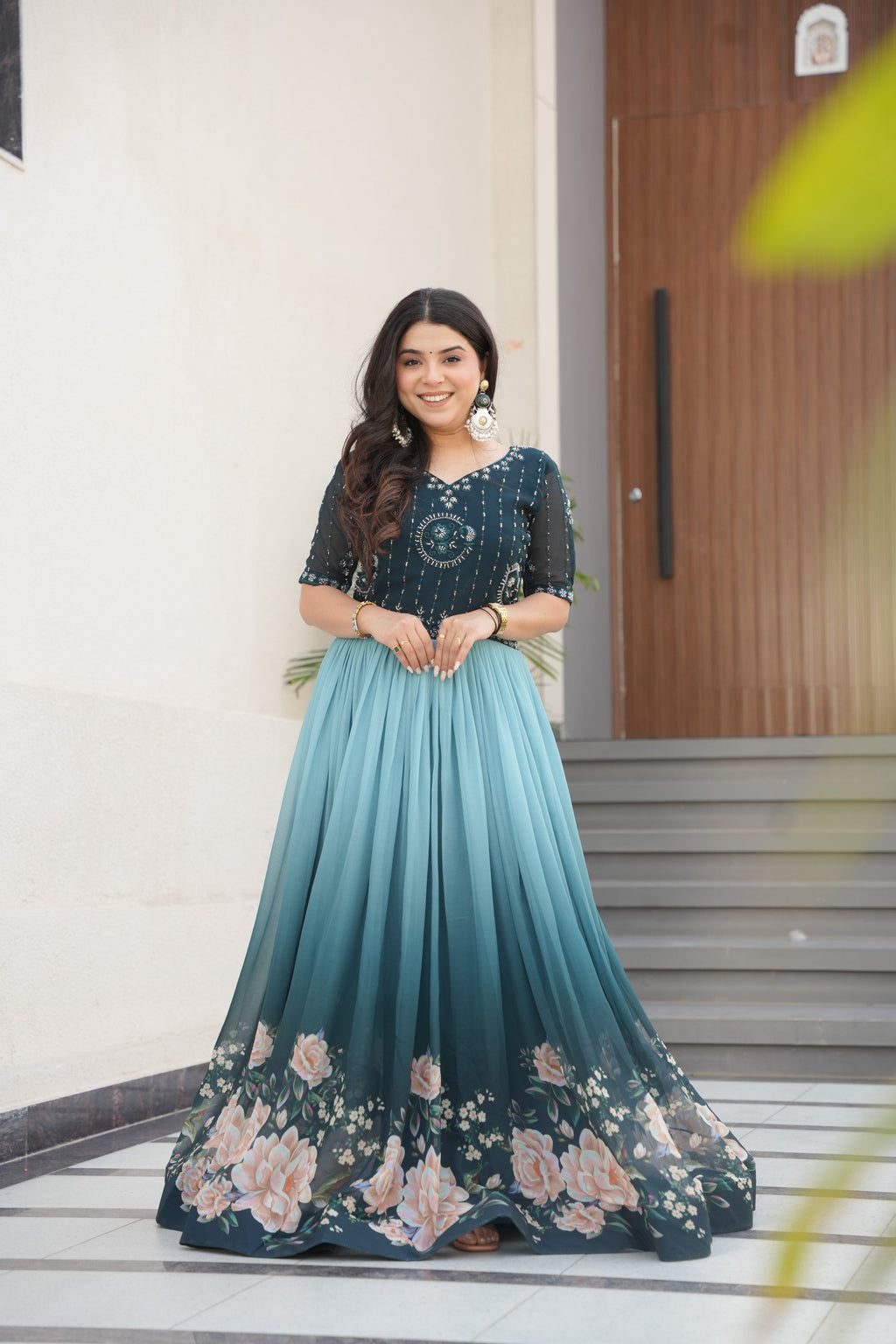 Hemrika Rama Color Embroidered Gown – designer rama green ethnic gown for women with floral digital print and beads embroidery, premium faux blooming floor-length gown, half sleeve Anarkali gown with round neckline, canvas patta stitching for extra flair, elegant Indian partywear and festive gown, fully lined with cotton for comfort, Trinaari ready to wear ethnic gown.