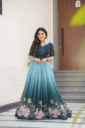 Hemrika Rama Color Embroidered Gown – designer rama green ethnic gown for women with floral digital print and beads embroidery, premium faux blooming floor-length gown, half sleeve Anarkali gown with round neckline, canvas patta stitching for extra flair, elegant Indian partywear and festive gown, fully lined with cotton for comfort, Trinaari ready to wear ethnic gown.
