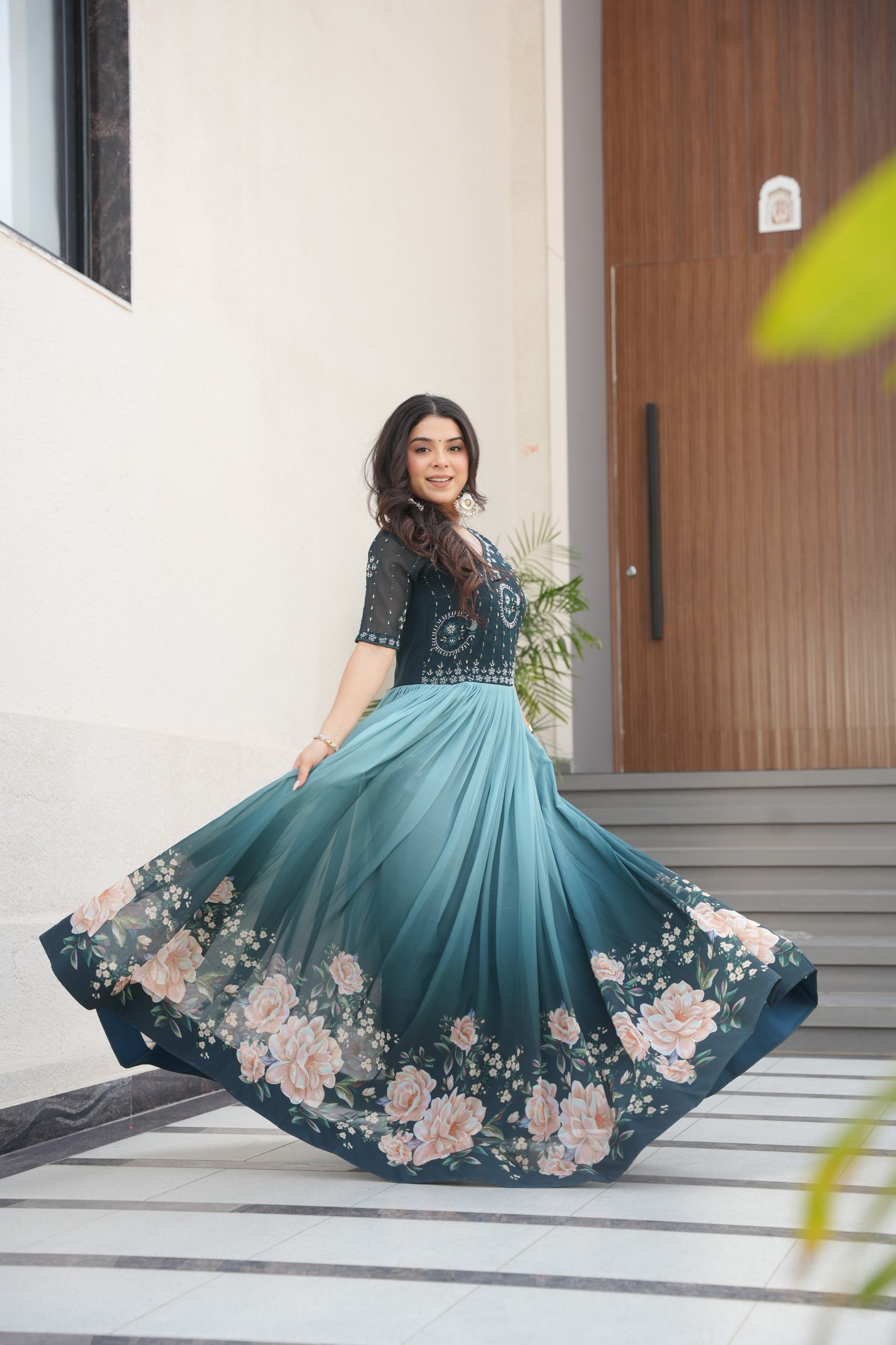 Hemrika Rama Color Embroidered Gown – designer rama green ethnic gown for women with floral digital print and beads embroidery, premium faux blooming floor-length gown, half sleeve Anarkali gown with round neckline, canvas patta stitching for extra flair, elegant Indian partywear and festive gown, fully lined with cotton for comfort, Trinaari ready to wear ethnic gown.