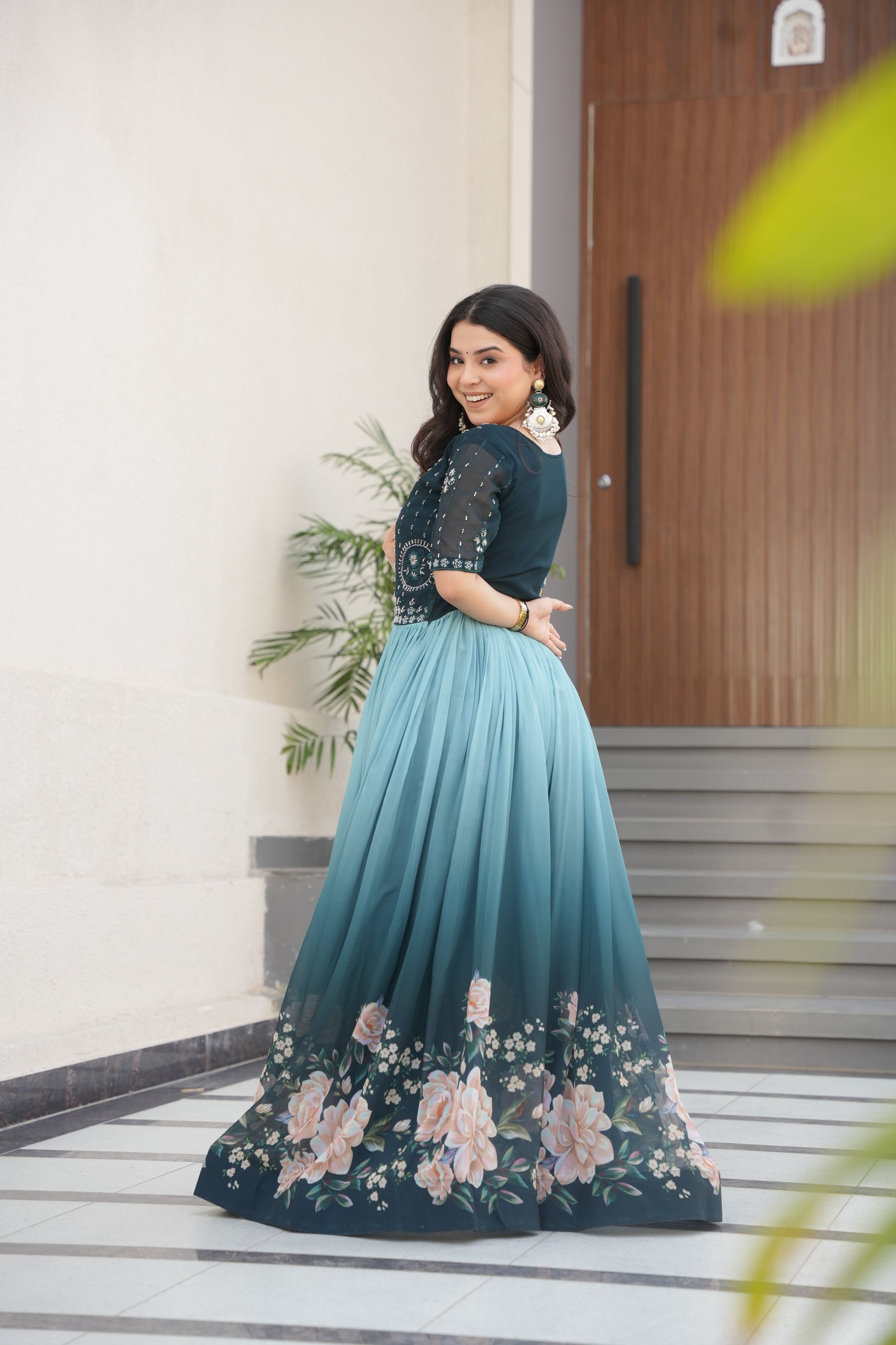 Hemrika Rama Color Embroidered Gown – designer rama green ethnic gown for women with floral digital print and beads embroidery, premium faux blooming floor-length gown, half sleeve Anarkali gown with round neckline, canvas patta stitching for extra flair, elegant Indian partywear and festive gown, fully lined with cotton for comfort, Trinaari ready to wear ethnic gown.