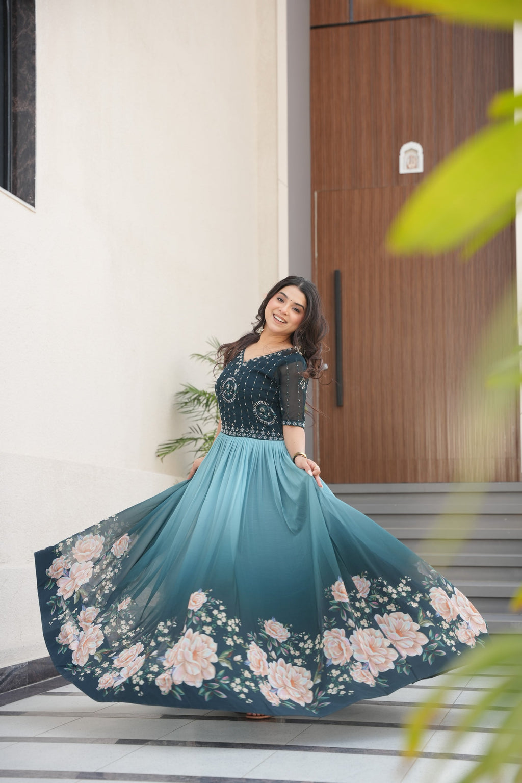 Hemrika Rama Color Embroidered Gown – designer rama green ethnic gown for women with floral digital print and beads embroidery, premium faux blooming floor-length gown, half sleeve Anarkali gown with round neckline, canvas patta stitching for extra flair, elegant Indian partywear and festive gown, fully lined with cotton for comfort, Trinaari ready to wear ethnic gown.