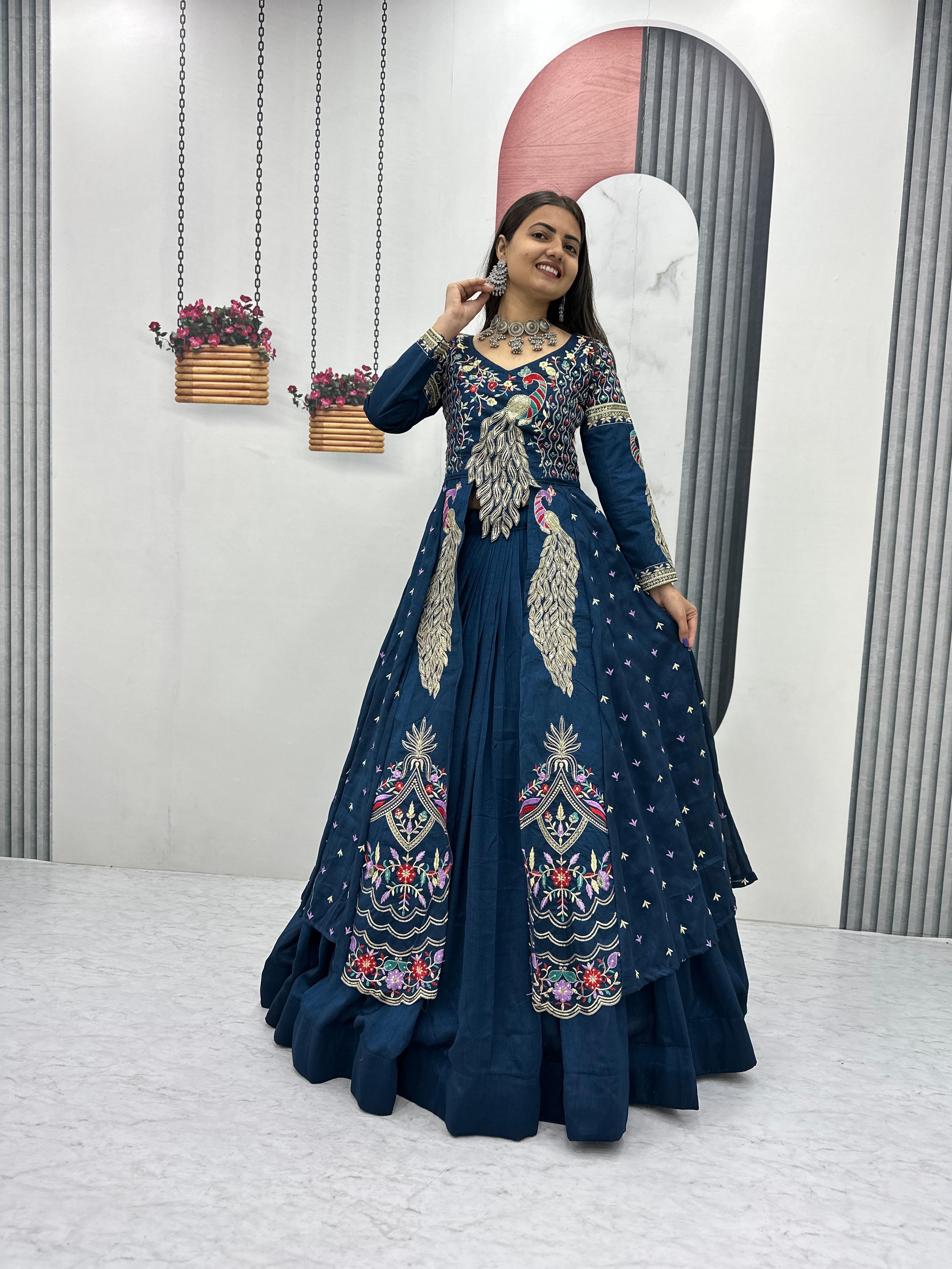 Mani teal blue vichitra silk crop top peacock design lehenga with embroidered shrug