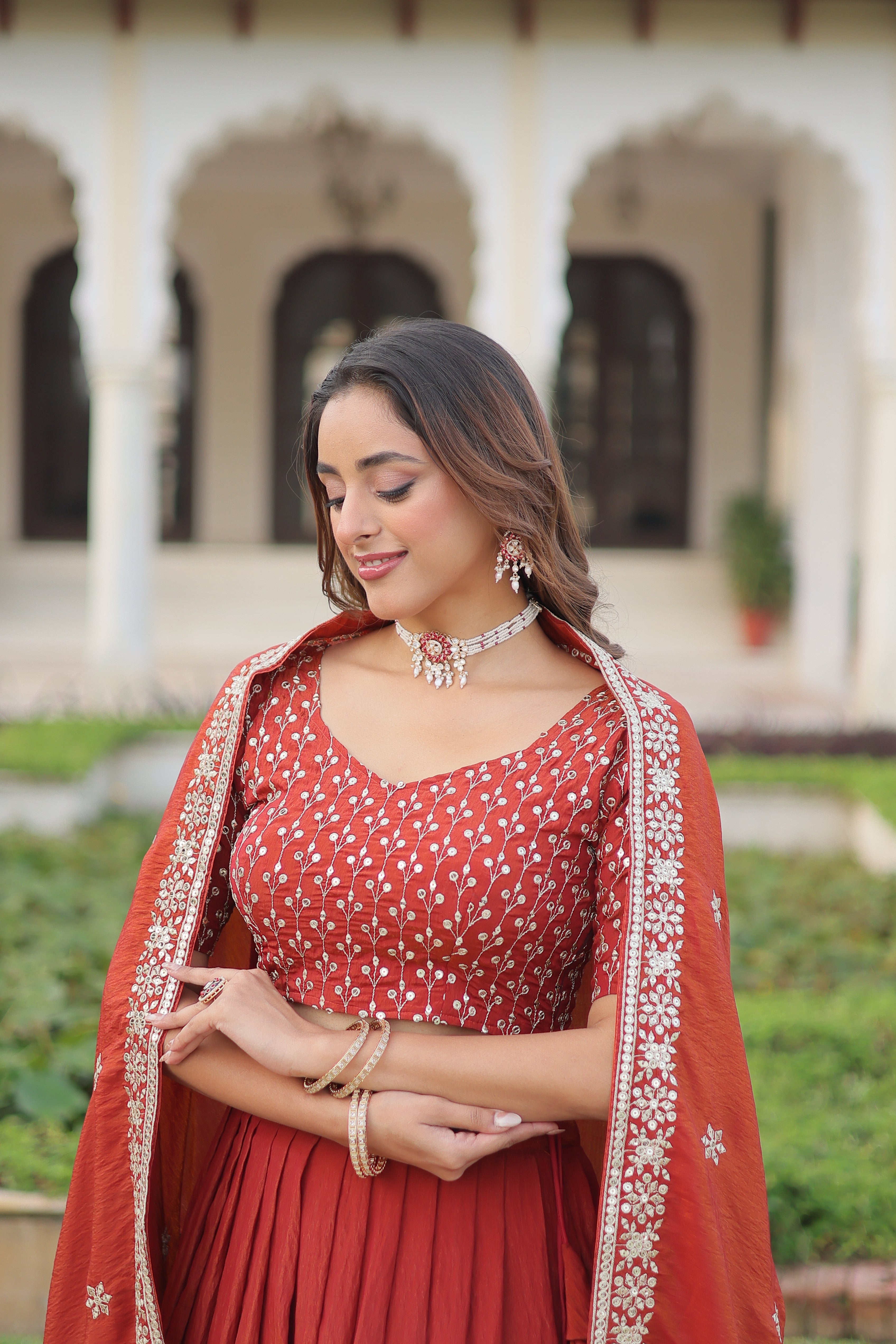 Omira orange Vichitra silk lehenga choli with sequins thread embroidery work