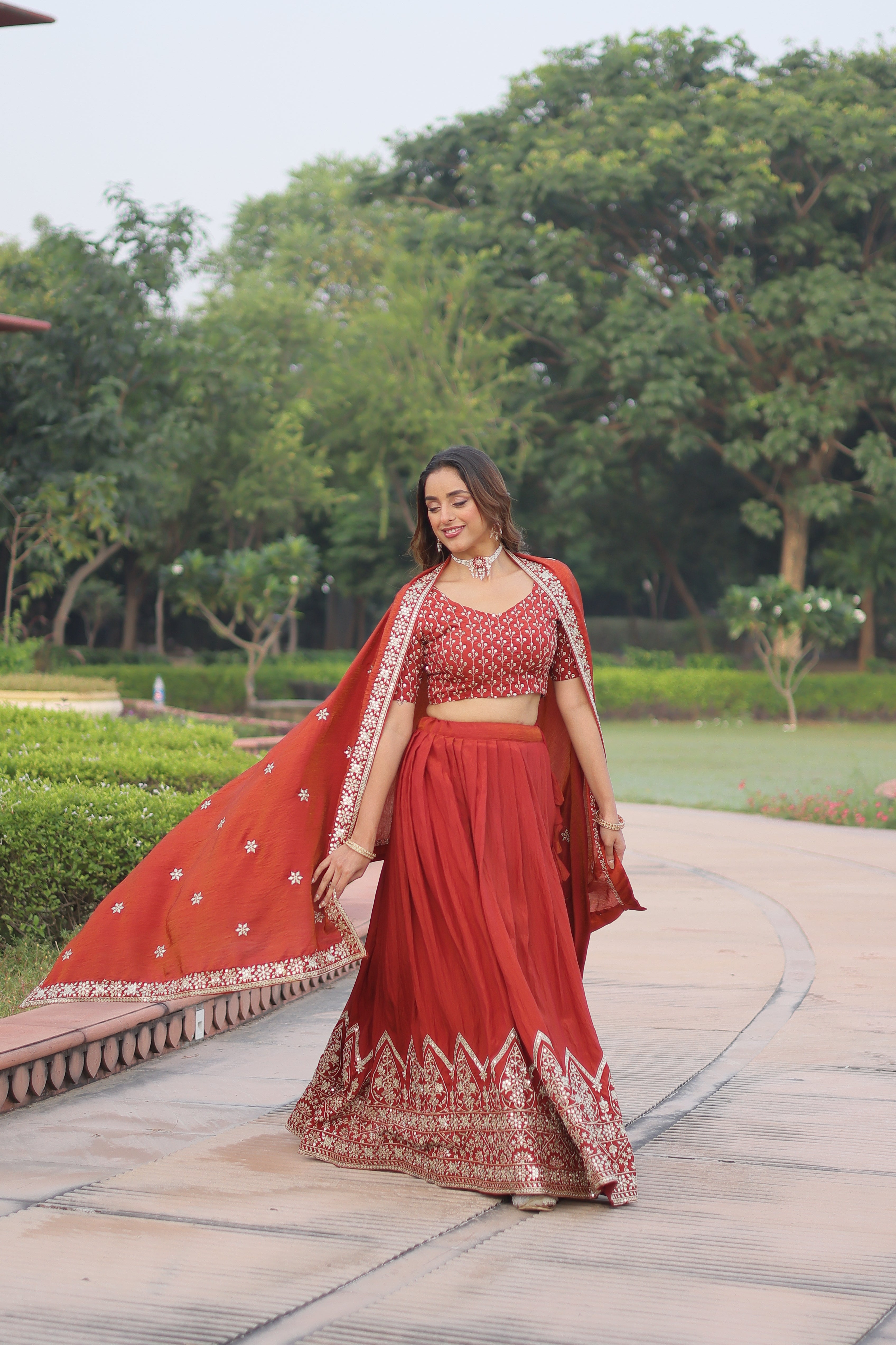 Omira orange Vichitra silk lehenga choli with sequins thread embroidery work