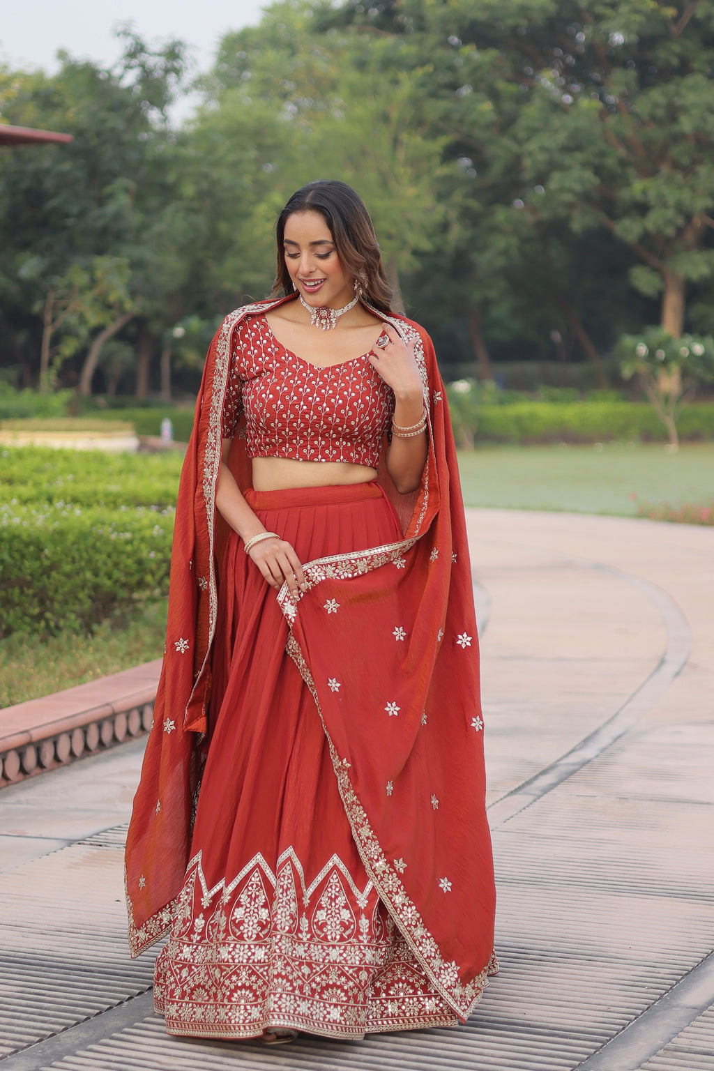 Omira orange Vichitra silk lehenga choli with sequins thread embroidery work