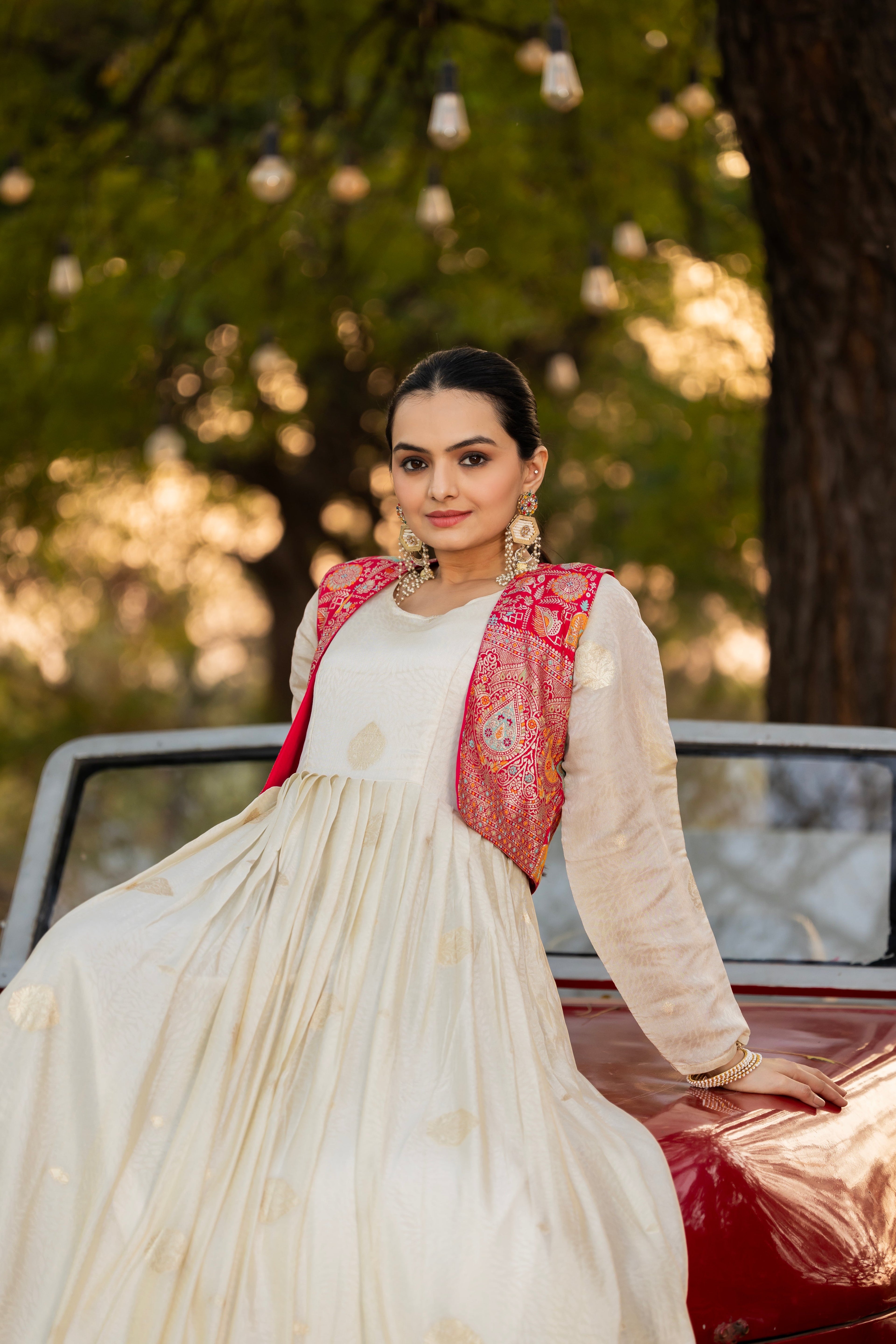 Off-white jacquard butti gown with pink koti