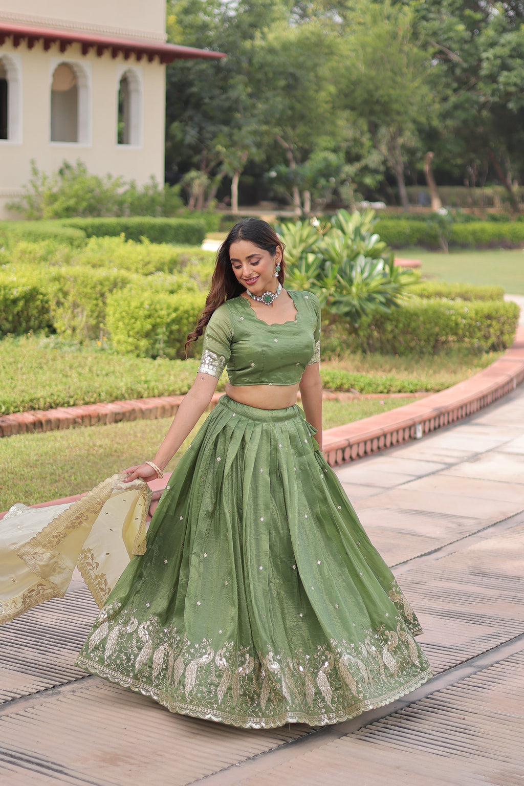Nirika green gold crush lehenga choli with sequins zari embroidered work
