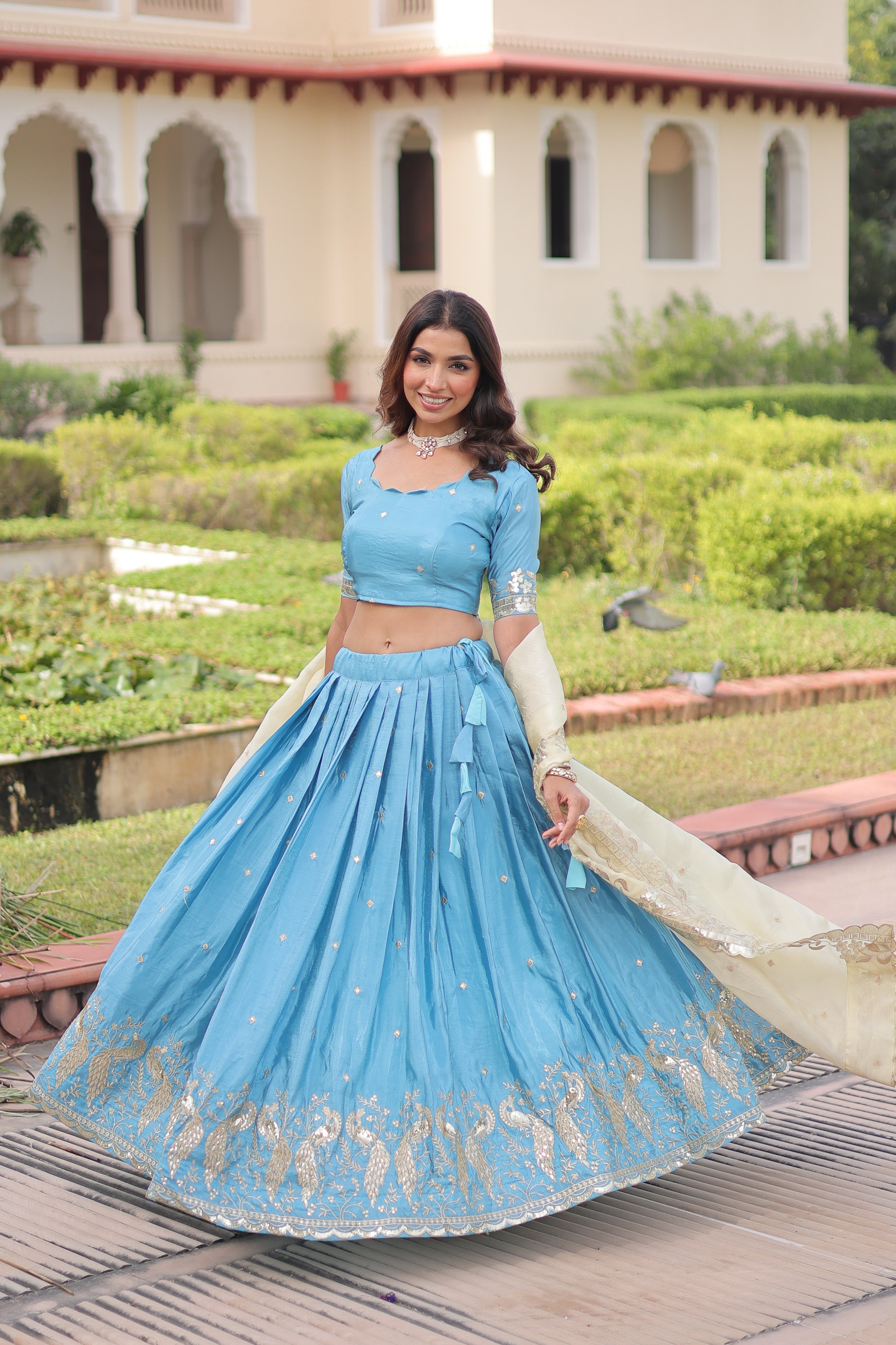 Nirika sky blue gold crush lehenga choli with sequins zari embroidered work