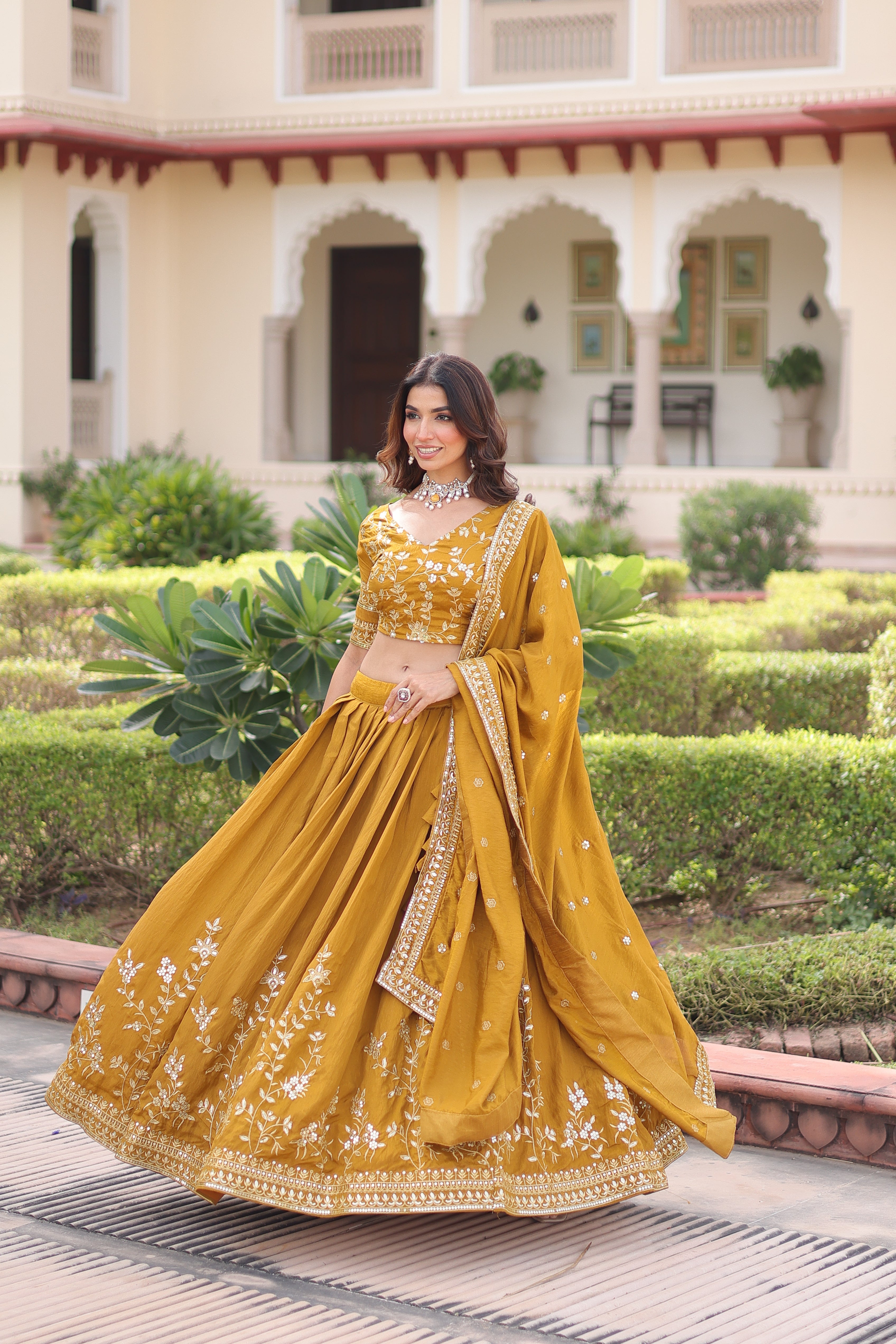 Ruvika mustard yellow Vichitra silk lehenga choli with sequins zari embroidered work