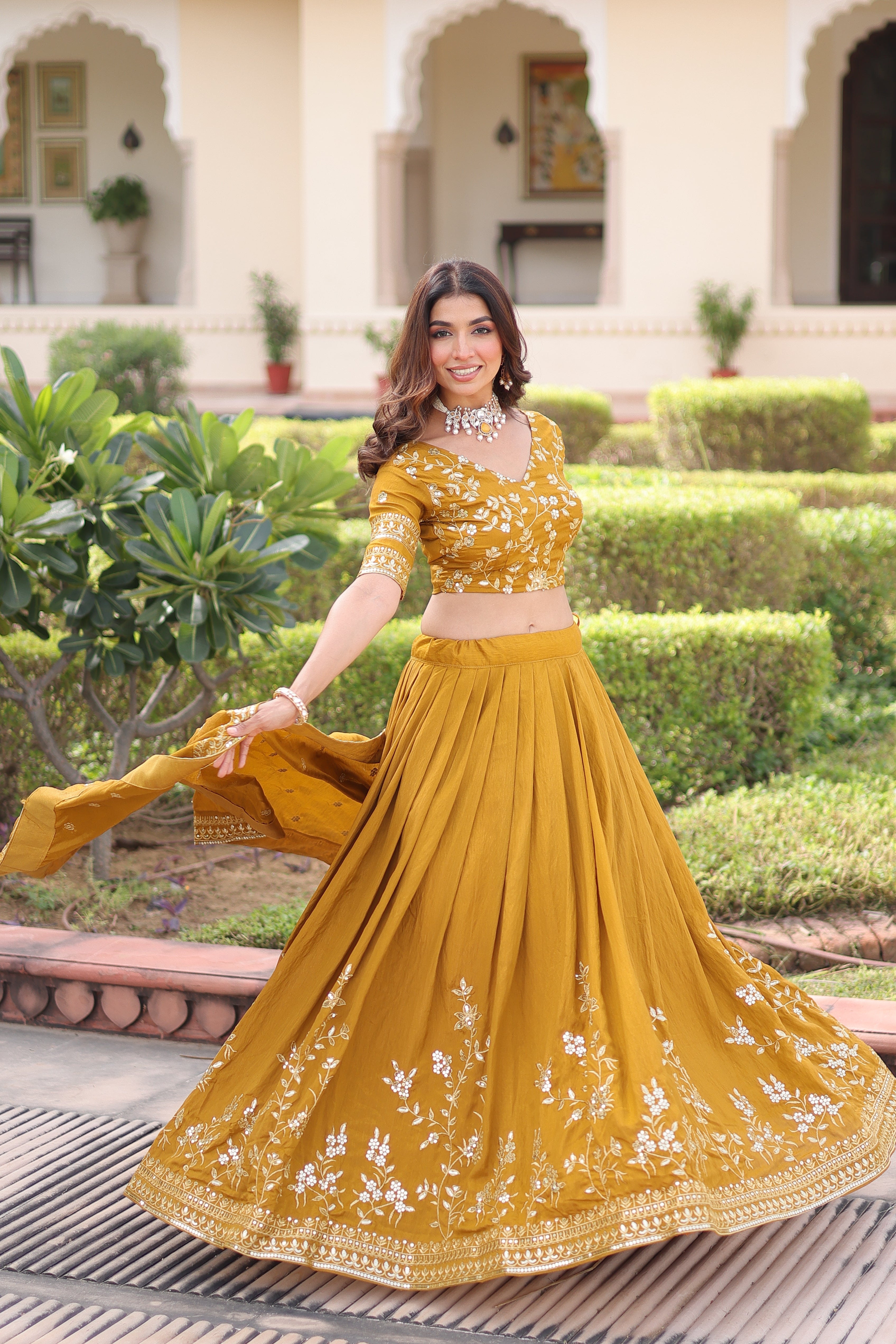 Ruvika mustard yellow Vichitra silk lehenga choli with sequins zari embroidered work