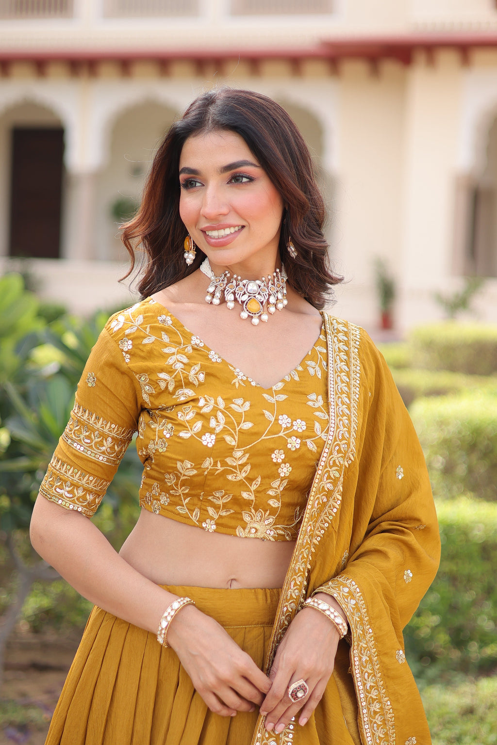 Ruvika mustard yellow Vichitra silk lehenga choli with sequins zari embroidered work