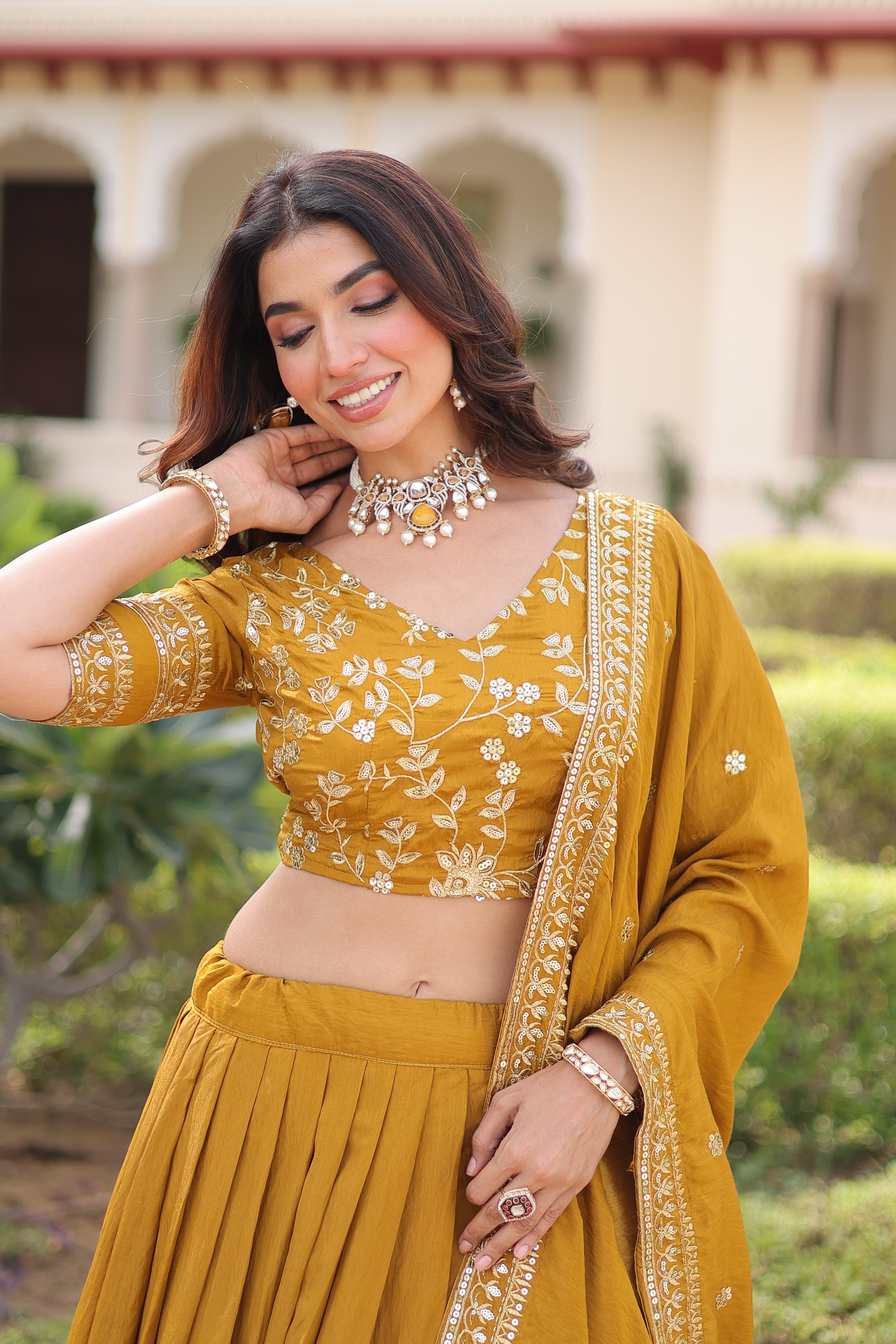 Ruvika mustard yellow Vichitra silk lehenga choli with sequins zari embroidered work