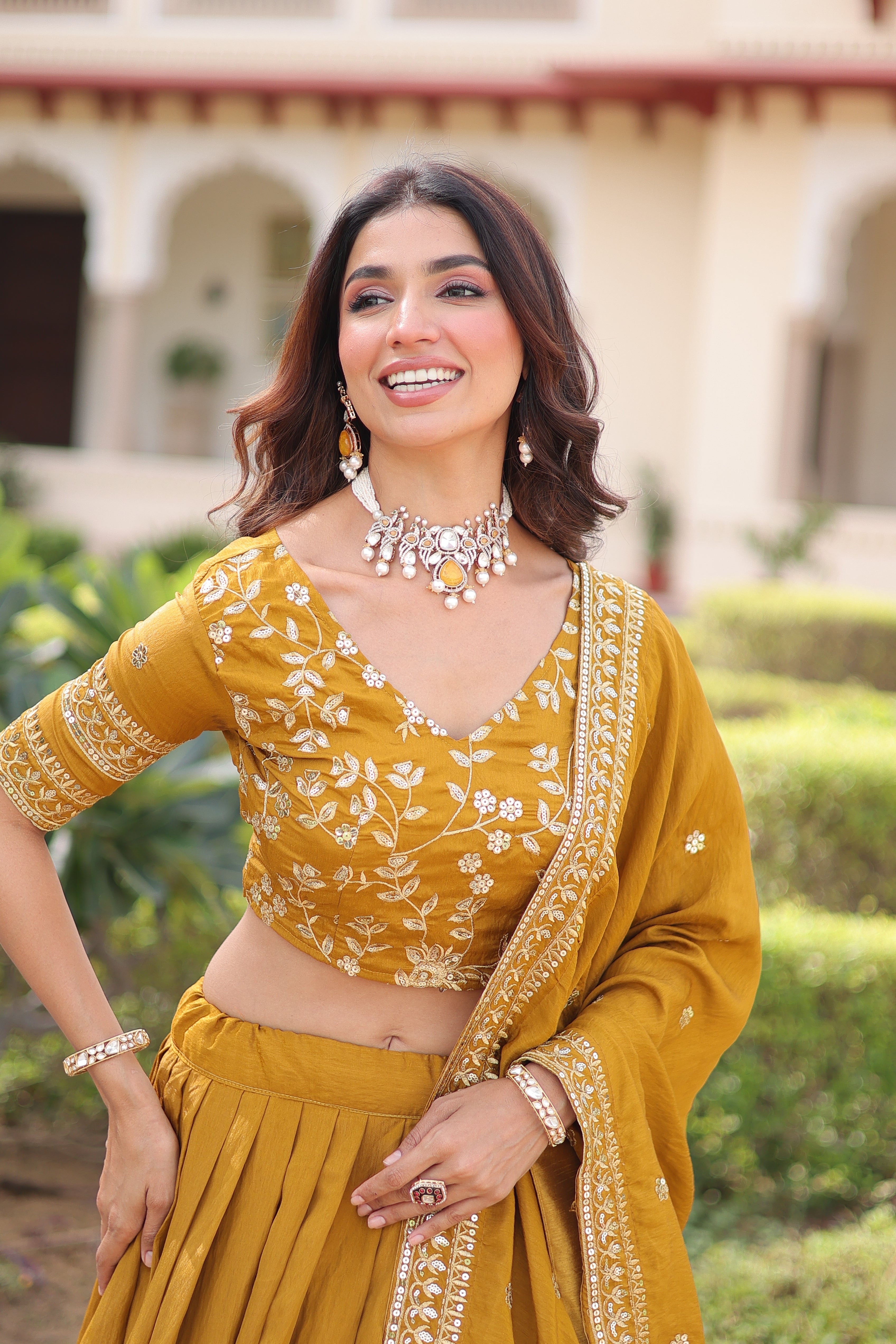 Ruvika mustard yellow Vichitra silk lehenga choli with sequins zari embroidered work