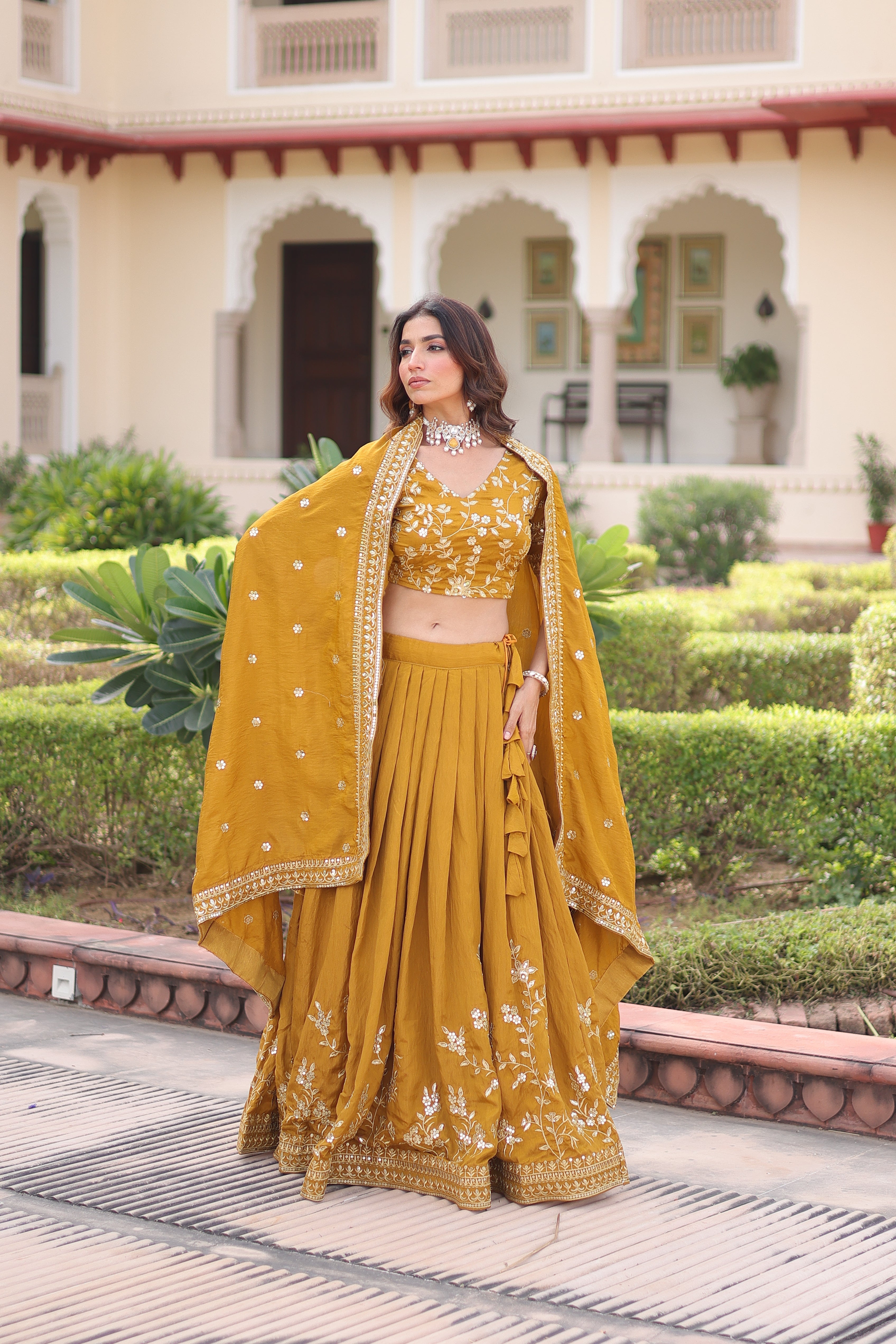 Ruvika mustard yellow Vichitra silk lehenga choli with sequins zari embroidered work