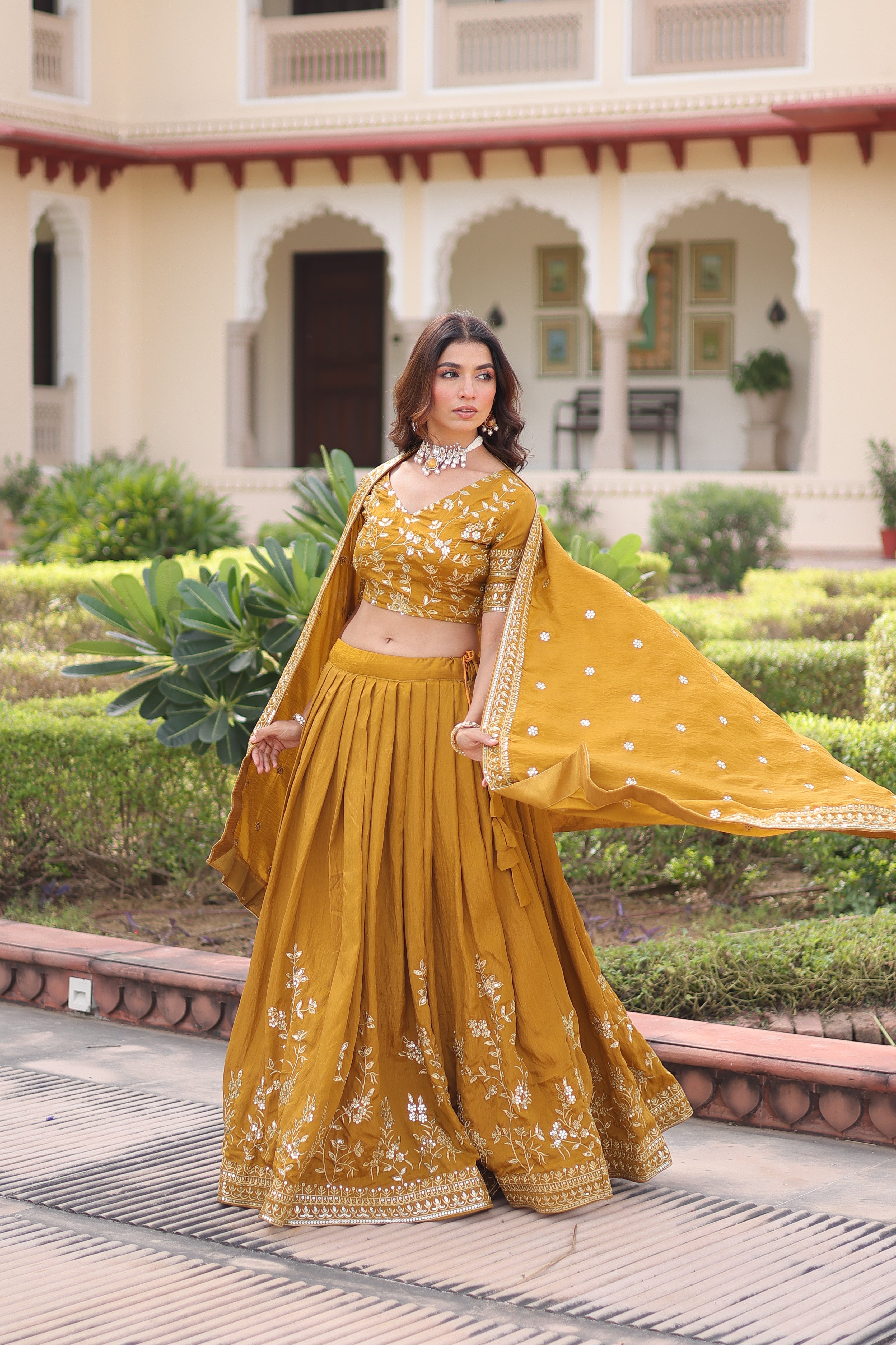 Ruvika mustard yellow Vichitra silk lehenga choli with sequins zari embroidered work