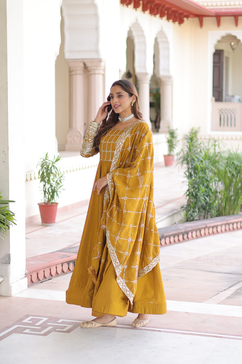 Navira mustard yellow Vichitra silk gown with rich sequins zari embroidery and dupatta