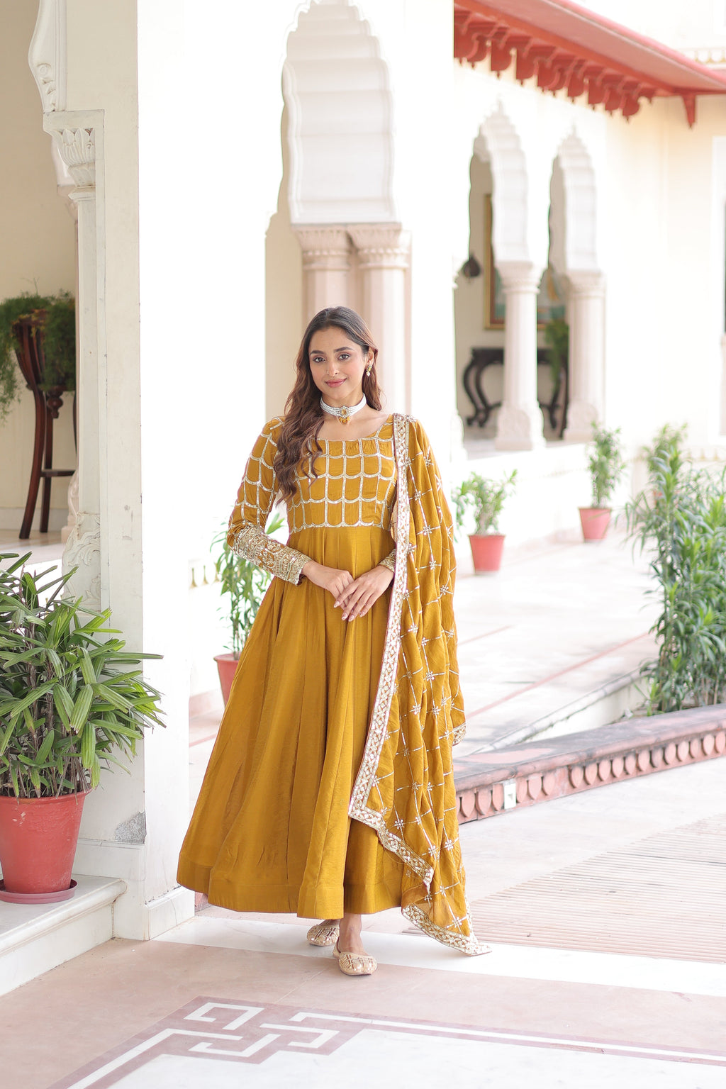 Navira mustard yellow Vichitra silk gown with rich sequins zari embroidery and dupatta