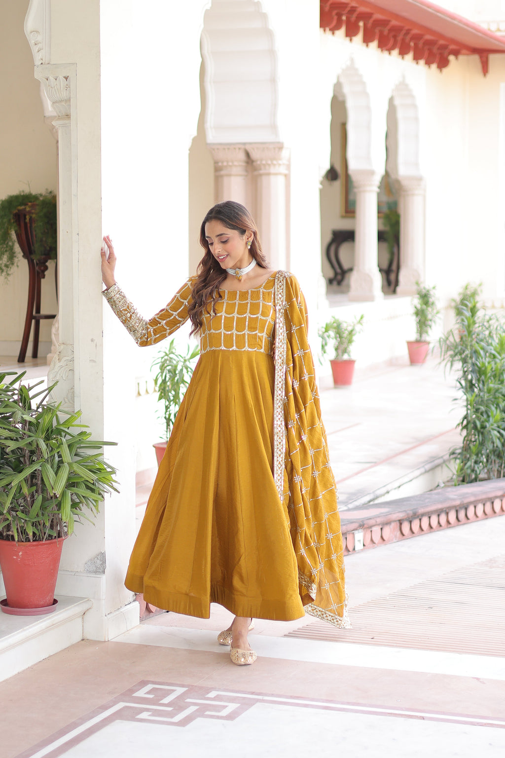 Navira mustard yellow Vichitra silk gown with rich sequins zari embroidery and dupatta