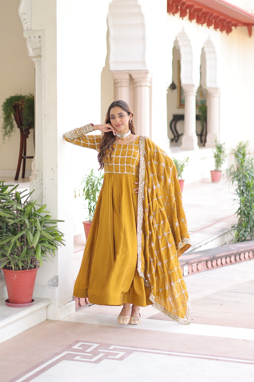 Navira mustard yellow Vichitra silk gown with rich sequins zari embroidery and dupatta