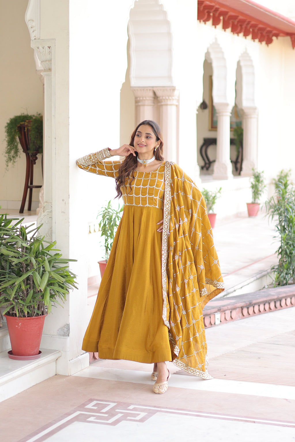 Navira mustard yellow Vichitra silk gown with rich sequins zari embroidery and dupatta