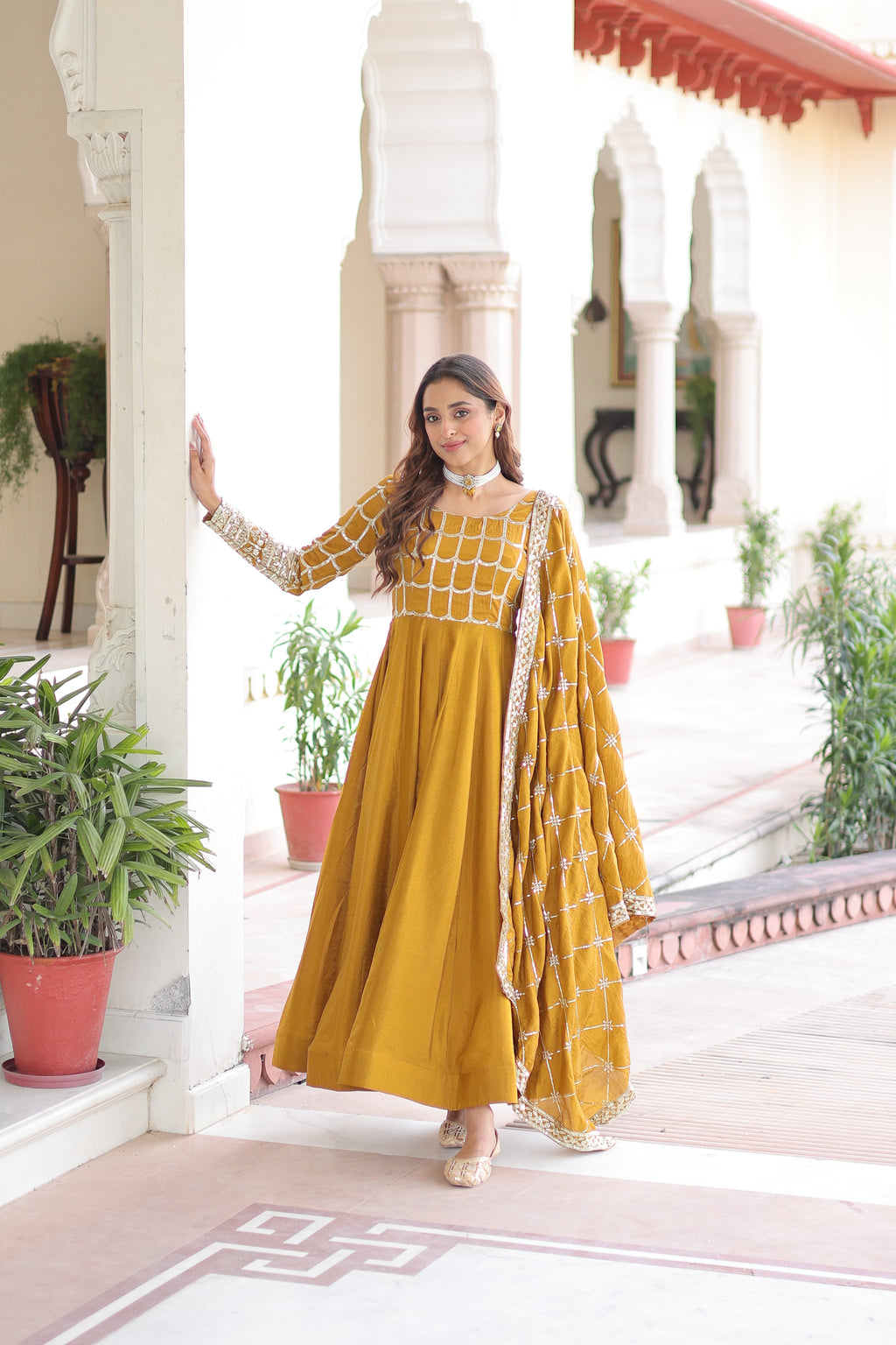 Navira mustard yellow Vichitra silk gown with rich sequins zari embroidery and dupatta