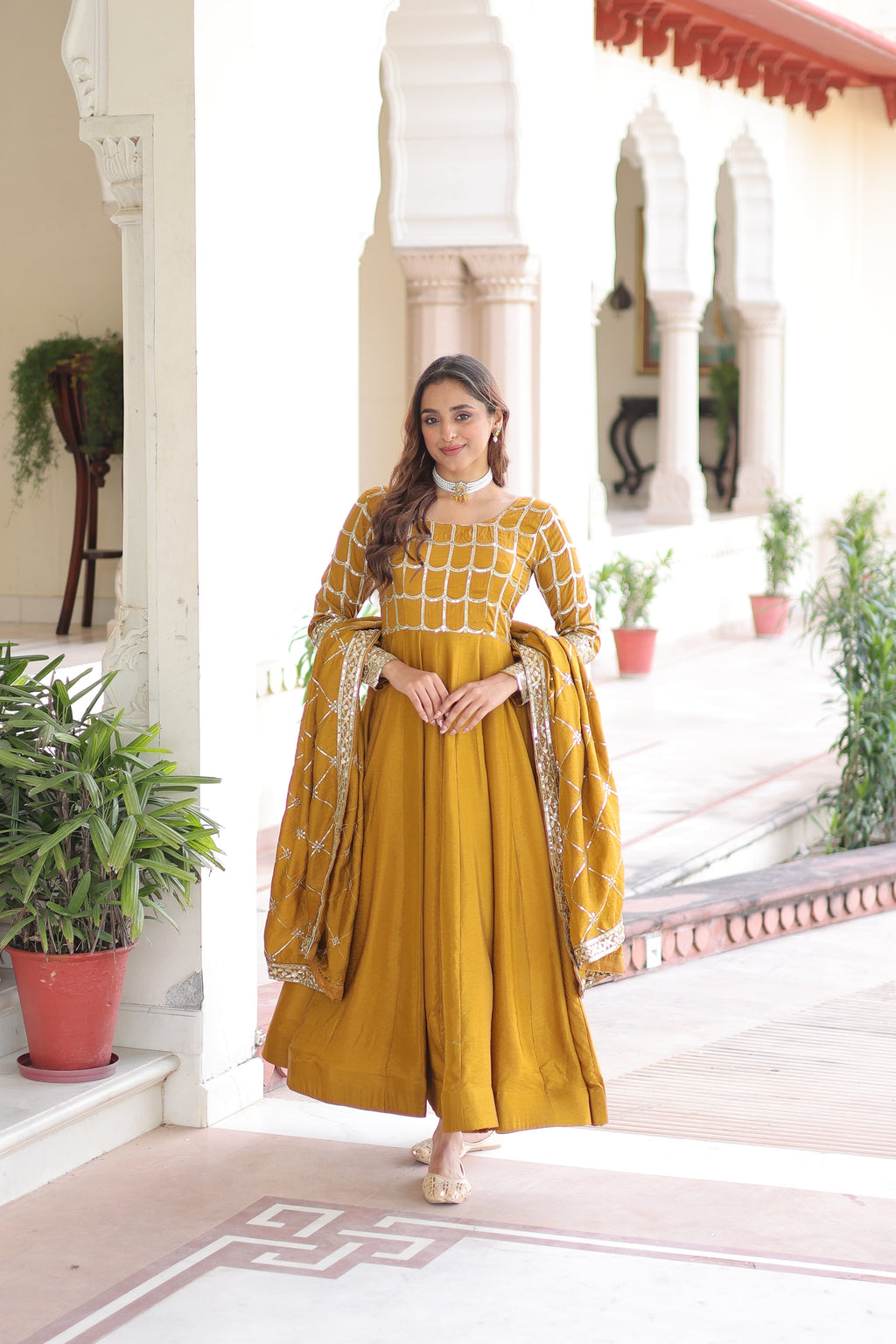 Navira mustard yellow Vichitra silk gown with rich sequins zari embroidery and dupatta