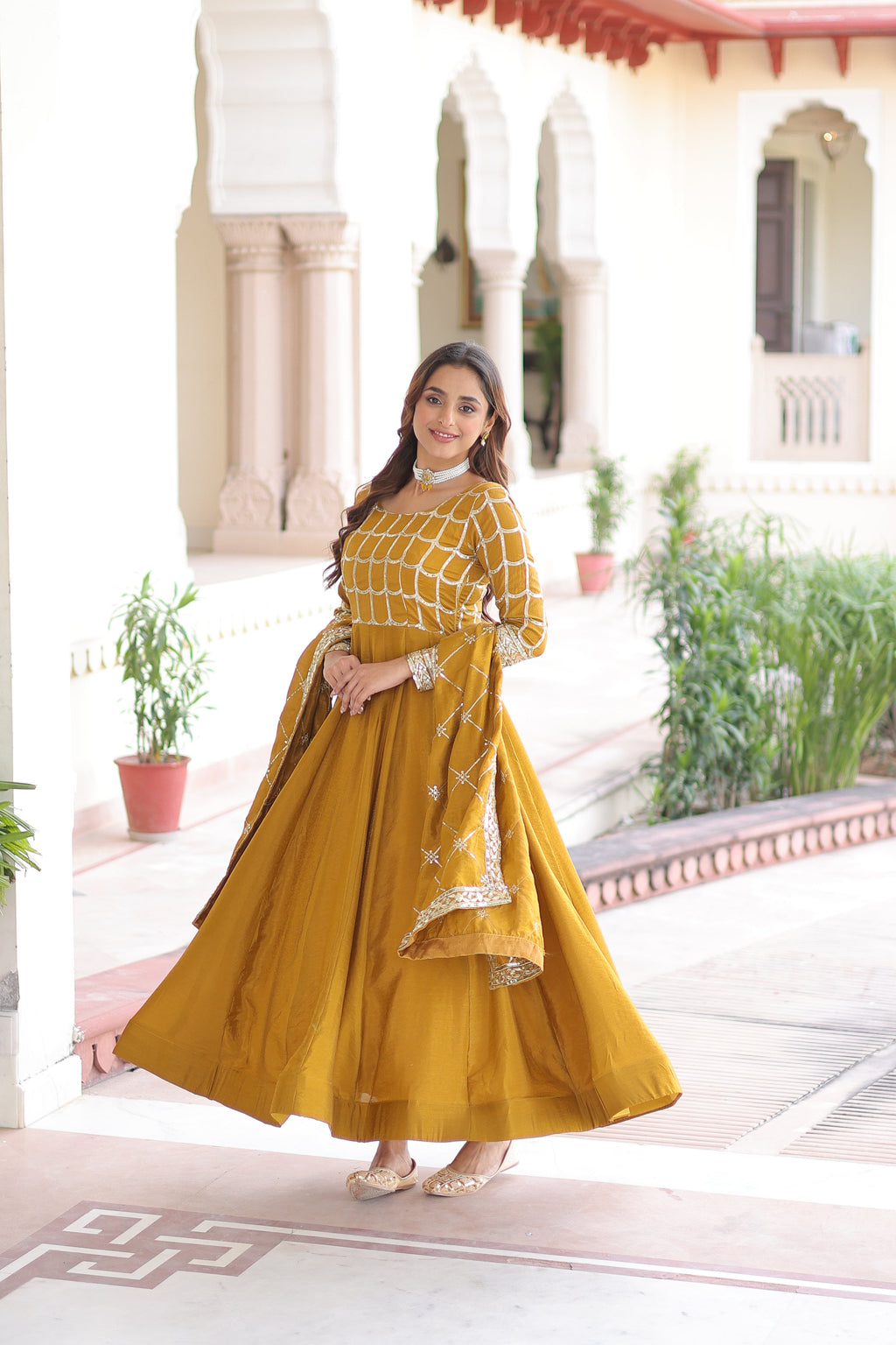Navira mustard yellow Vichitra silk gown with rich sequins zari embroidery and dupatta