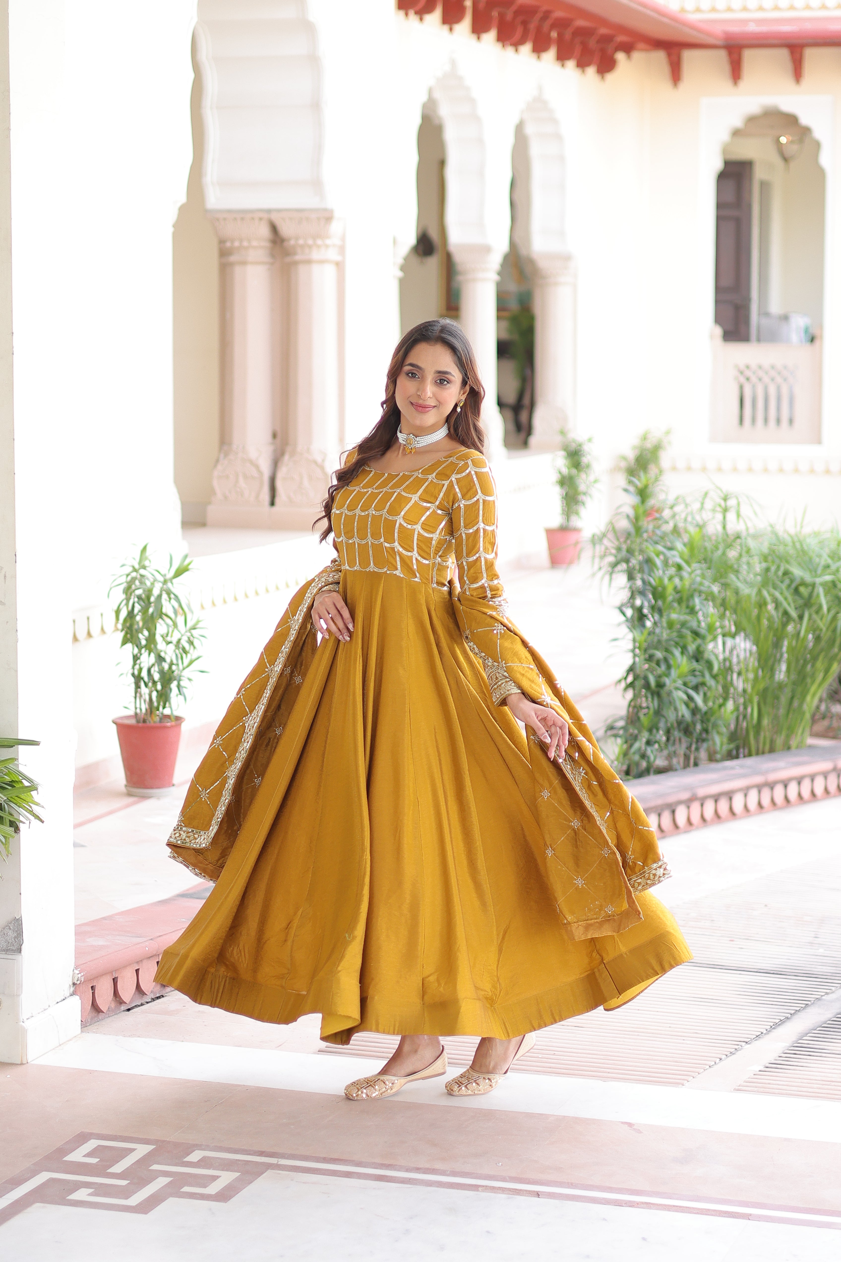 Navira mustard yellow Vichitra silk gown with rich sequins zari embroidery and dupatta
