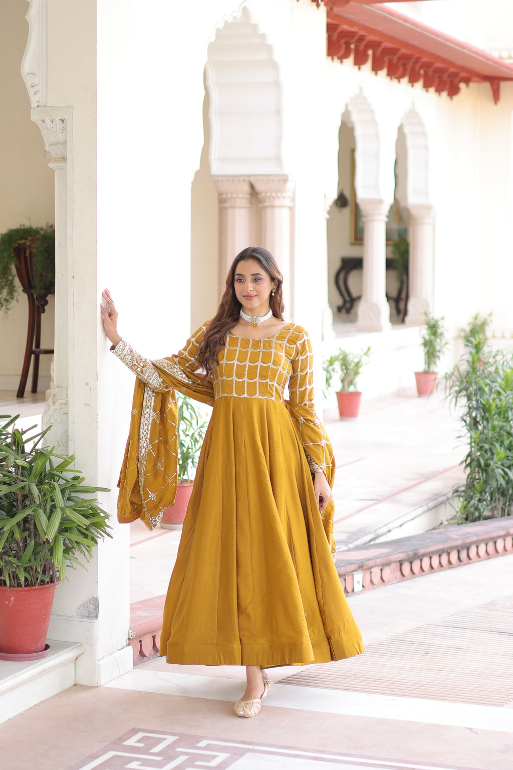 Navira mustard yellow Vichitra silk gown with rich sequins zari embroidery and dupatta