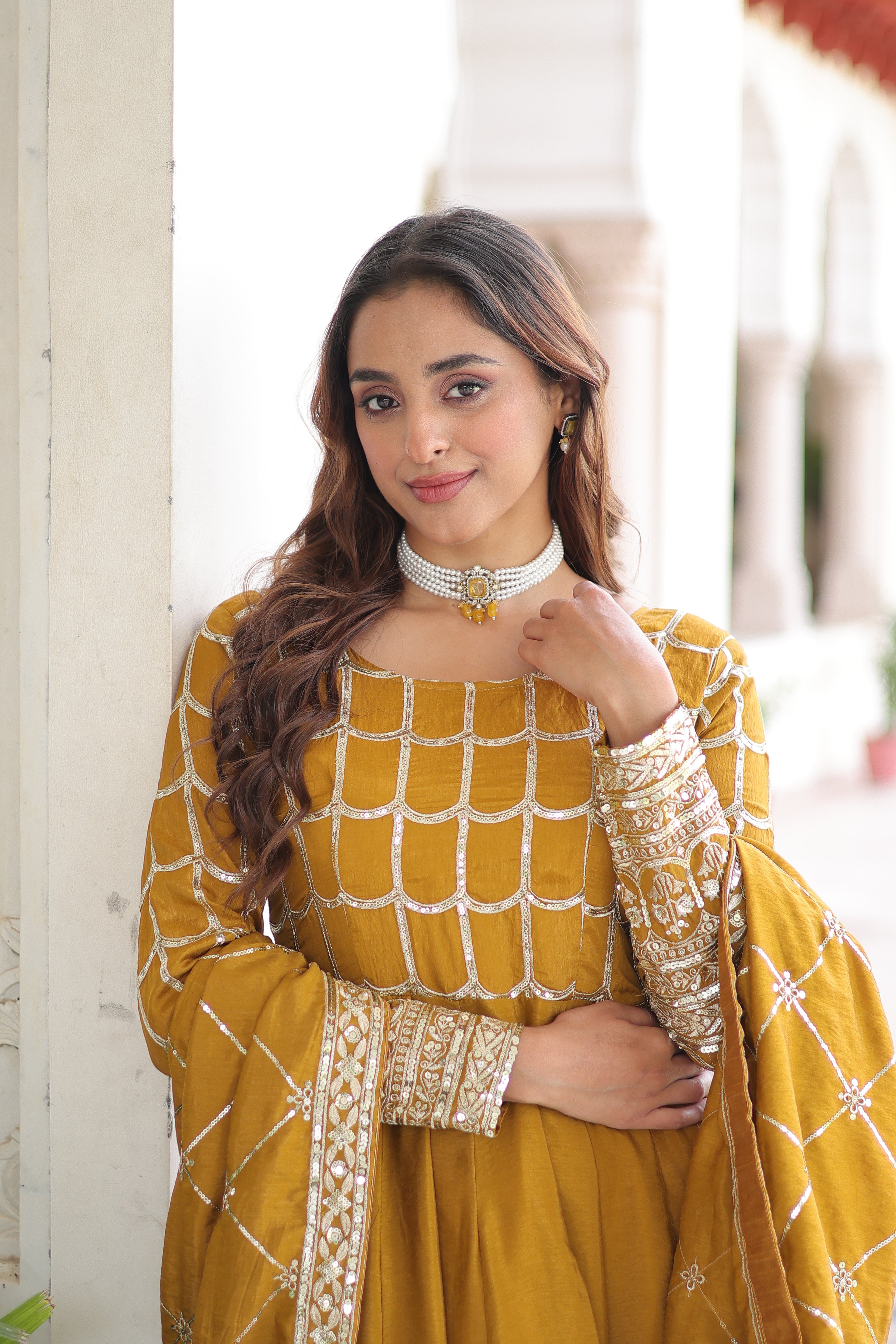 Navira mustard yellow Vichitra silk gown with rich sequins zari embroidery and dupatta