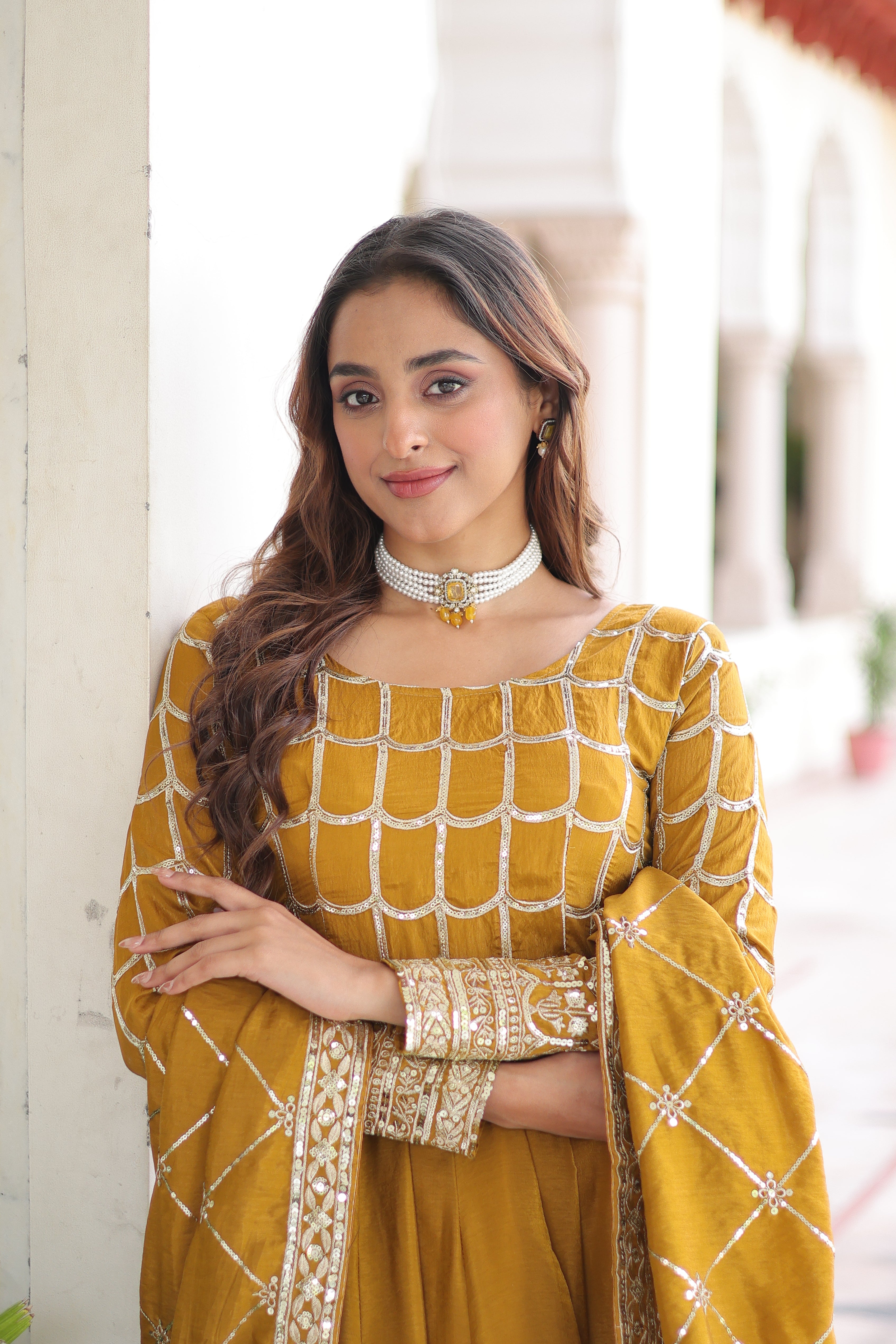 Navira mustard yellow Vichitra silk gown with rich sequins zari embroidery and dupatta