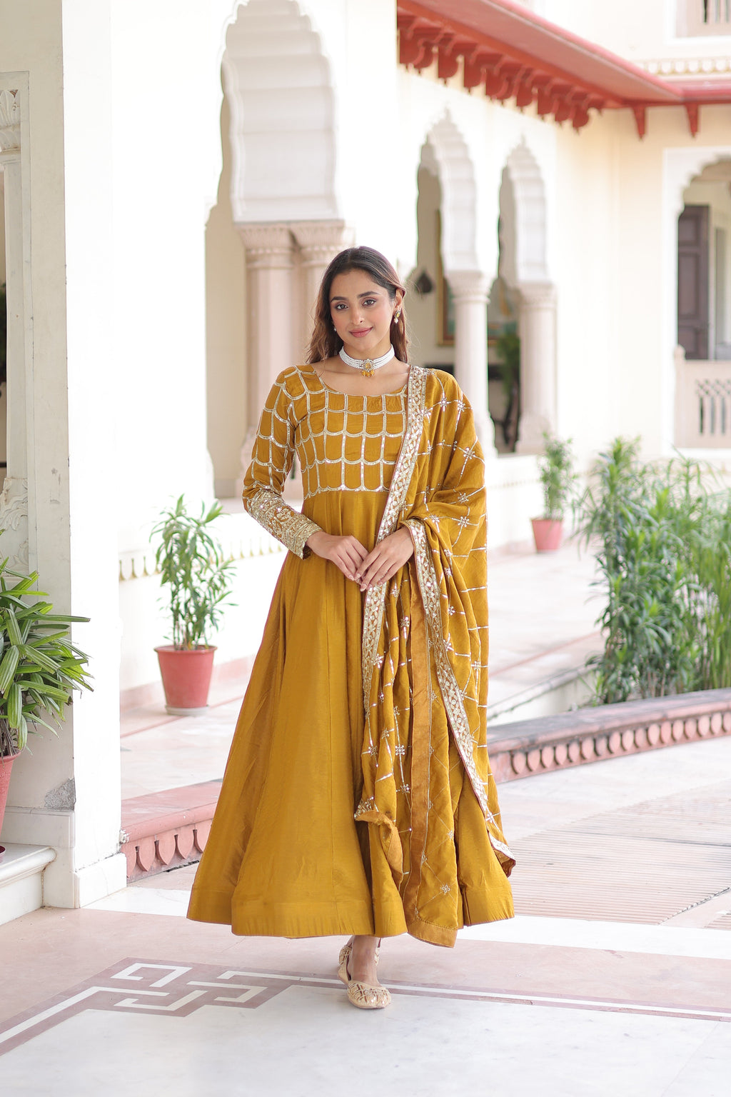 Navira mustard yellow Vichitra silk gown with rich sequins zari embroidery and dupatta