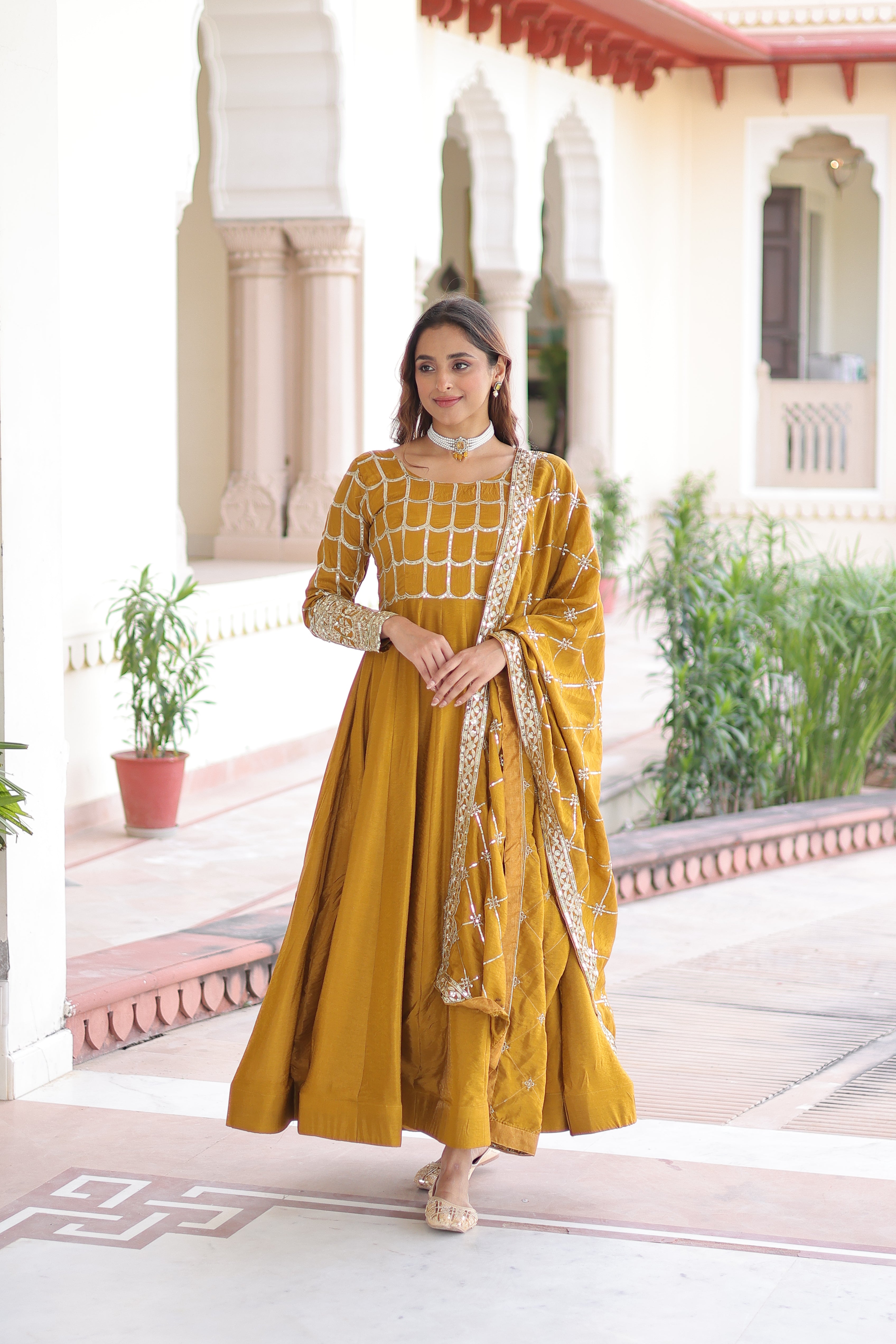 Navira mustard yellow Vichitra silk gown with rich sequins zari embroidery and dupatta